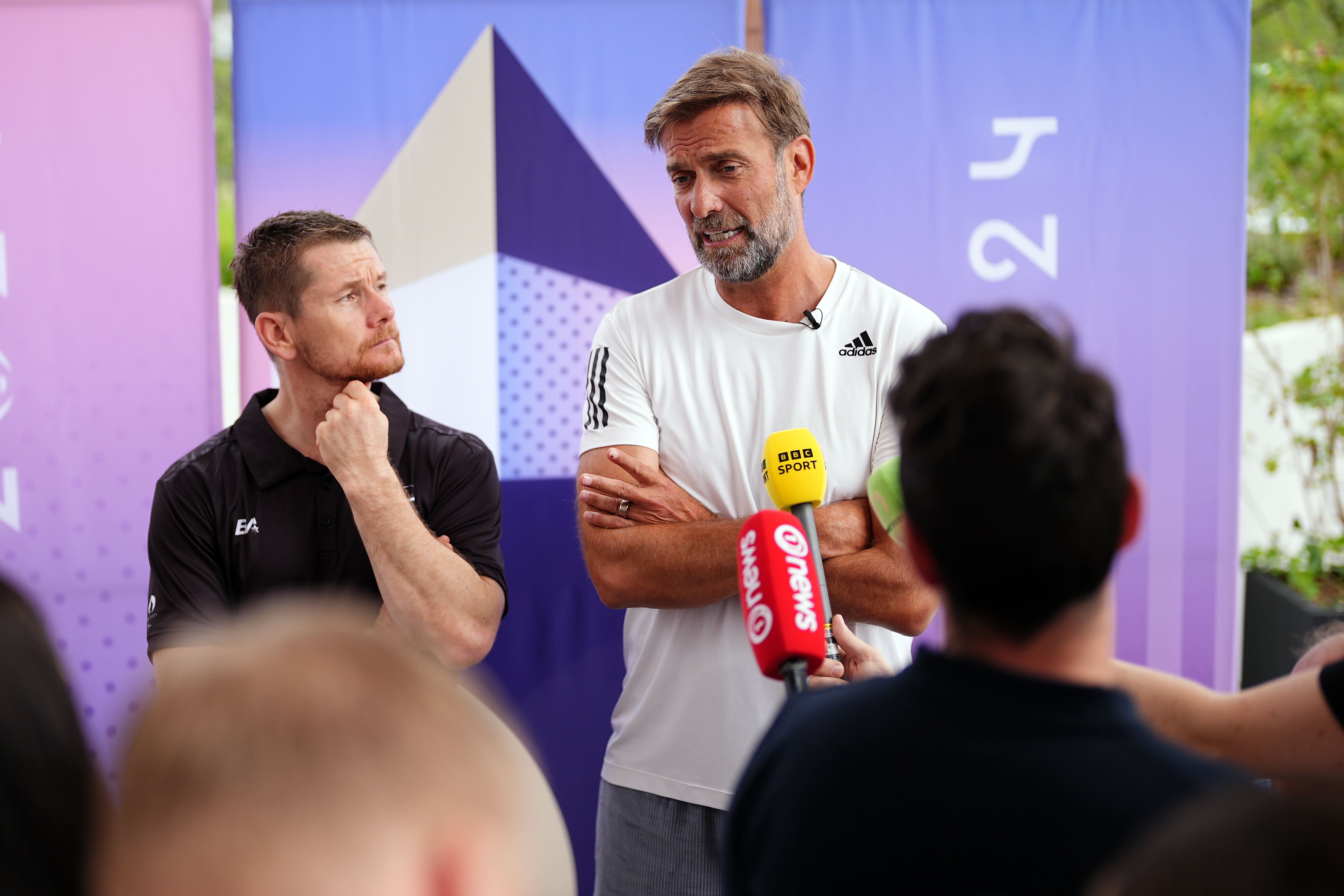 Jurgen Klopp (right) and New Zealand’s Wojtek Czyz (Zac Goodwin/PA)