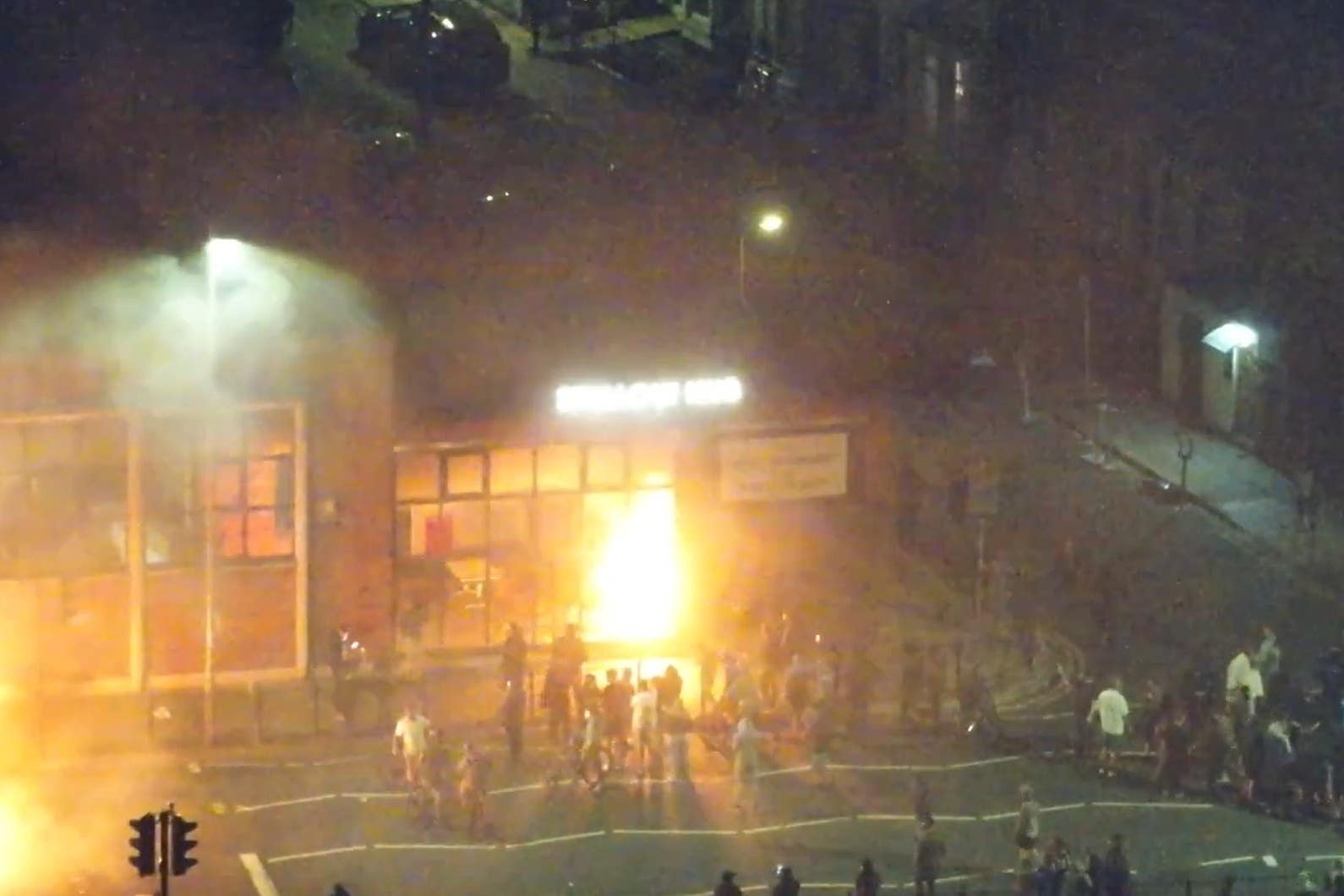 CCTV shows people setting fire to the Spellow Hub premises during widespread public disorder in Liverpool (CPS/PA)