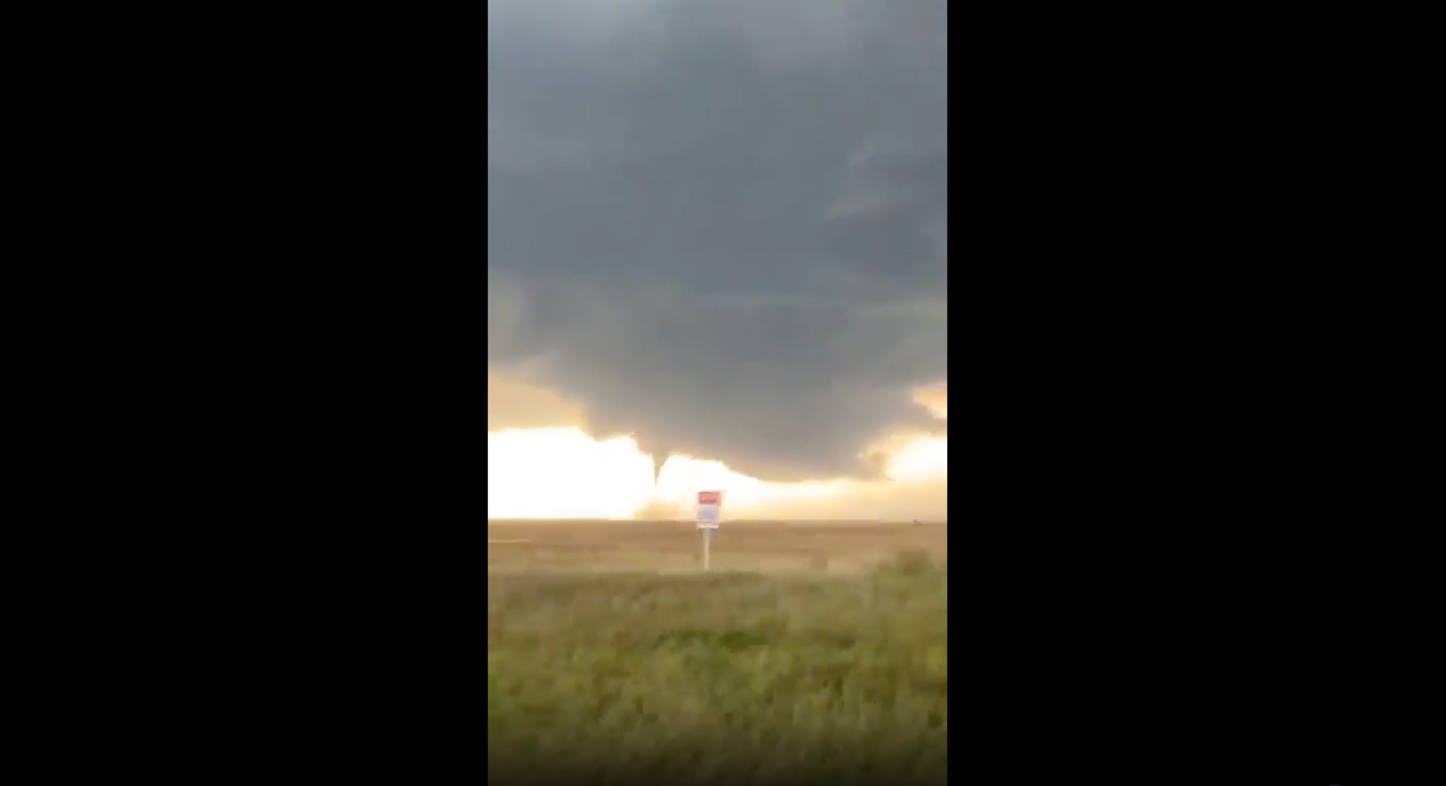 Tornadoes are caught on camera by a group driving away from the area on Wednesday near Selfridge, North Dakota. Bad weather was moving out of the area by Thursday