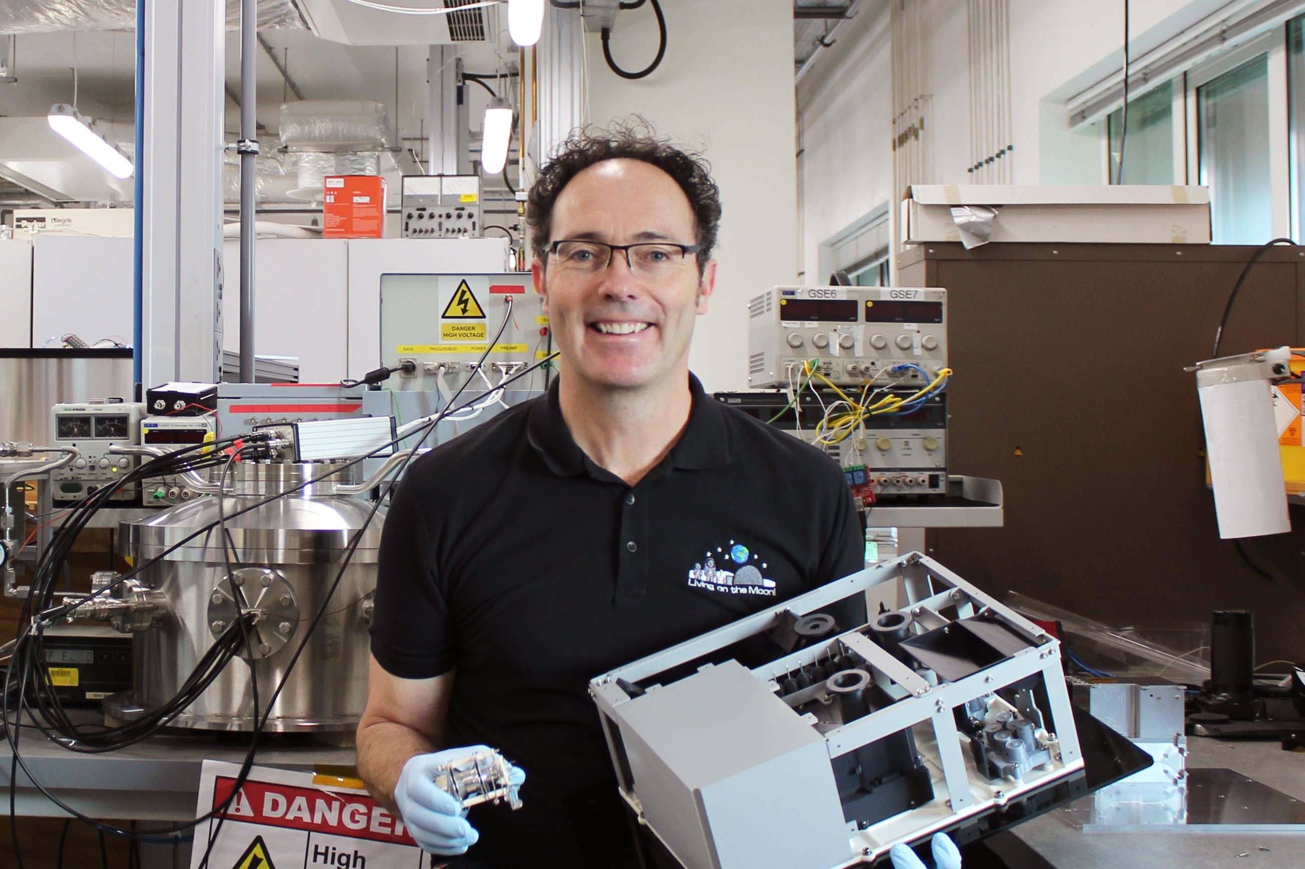 Dr Simeon Barber holding the ProSPA mini lab (The Open University/PA)