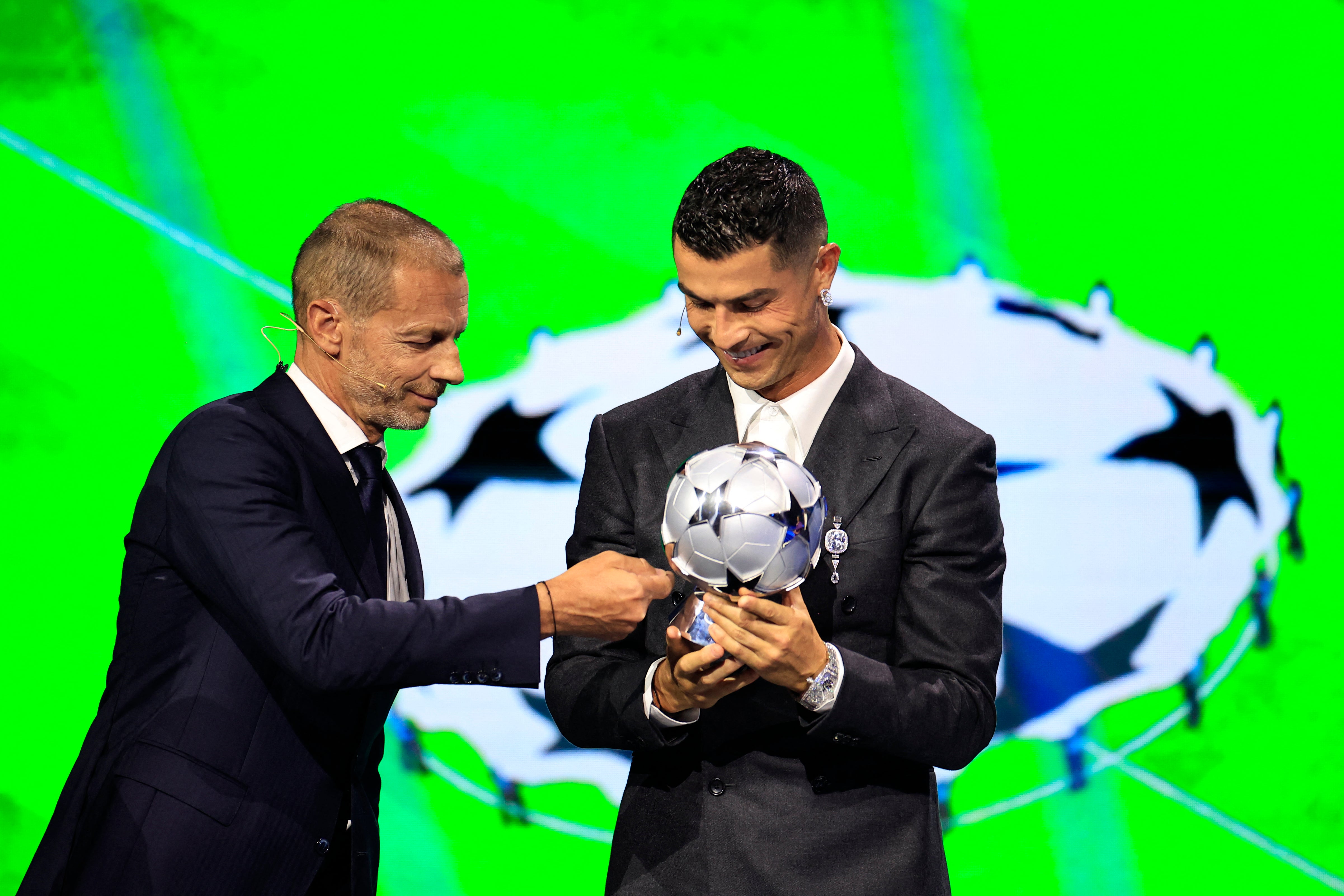 Ceferin presents a prize to Cristiano Ronaldo at the Champions League draw