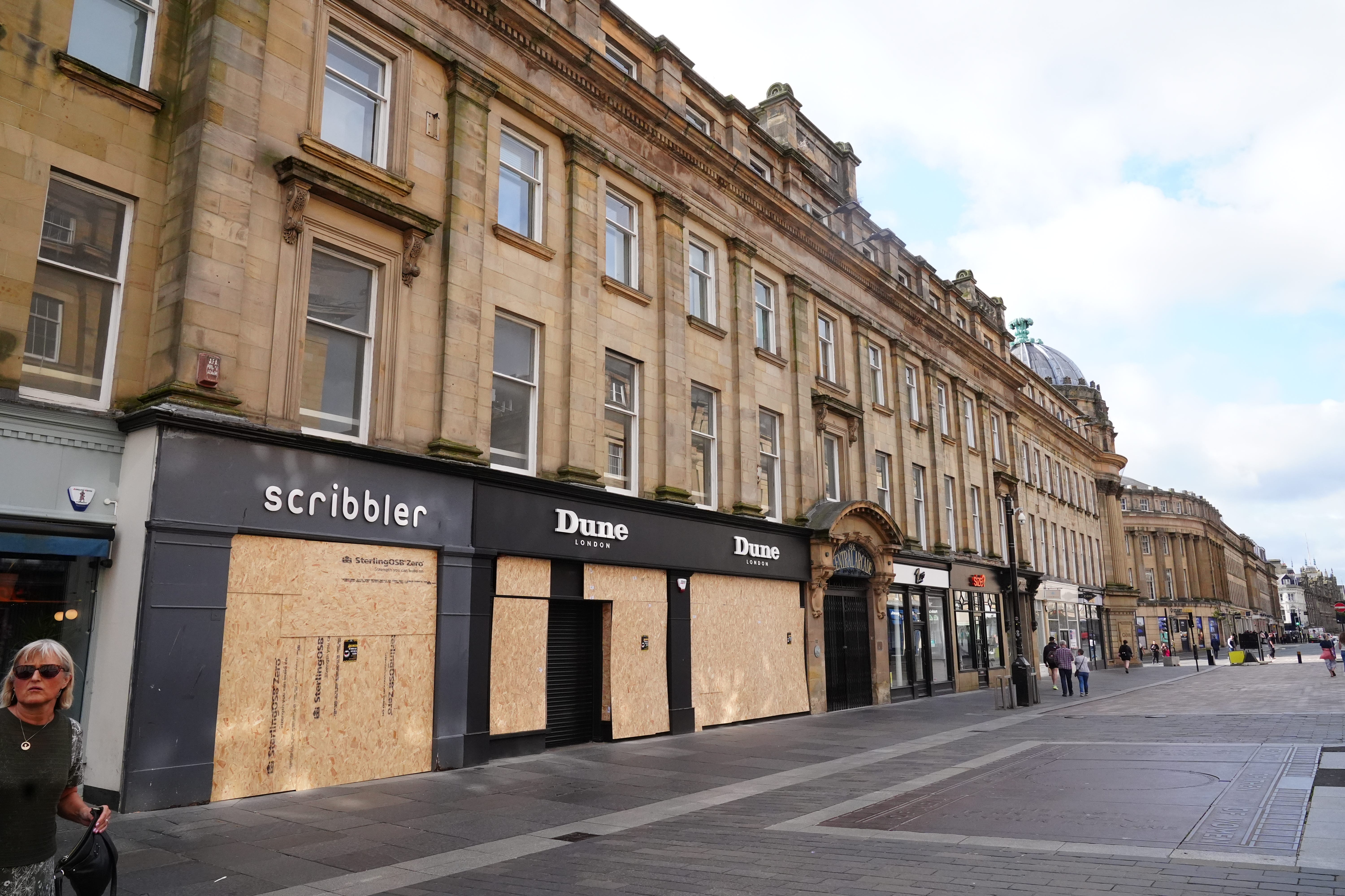 Windows of shops boarded up in Newcastle ahead of a far-right demonstration in August (PA)