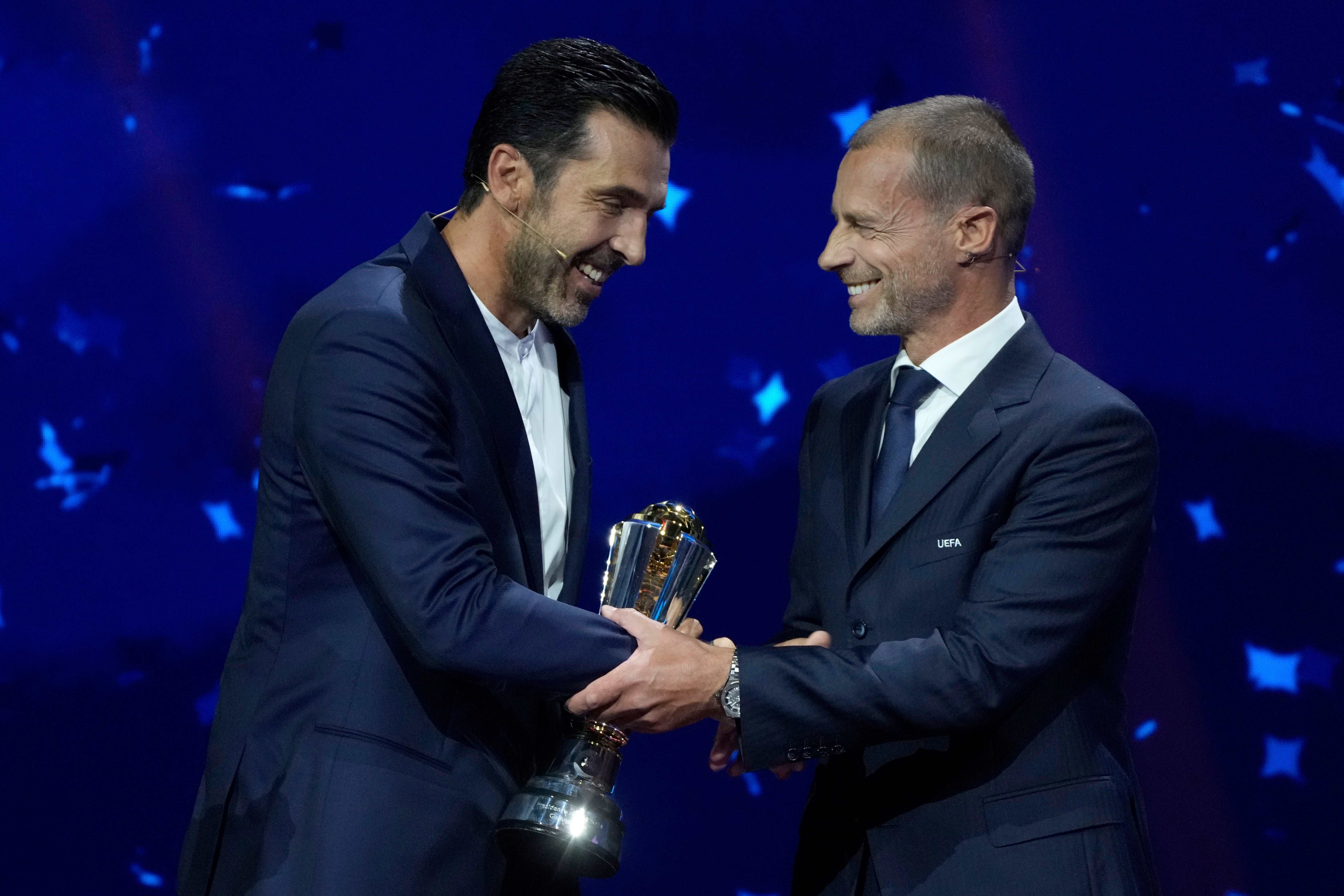 Gigi Buffon receives his award from Aleksander Ceferin