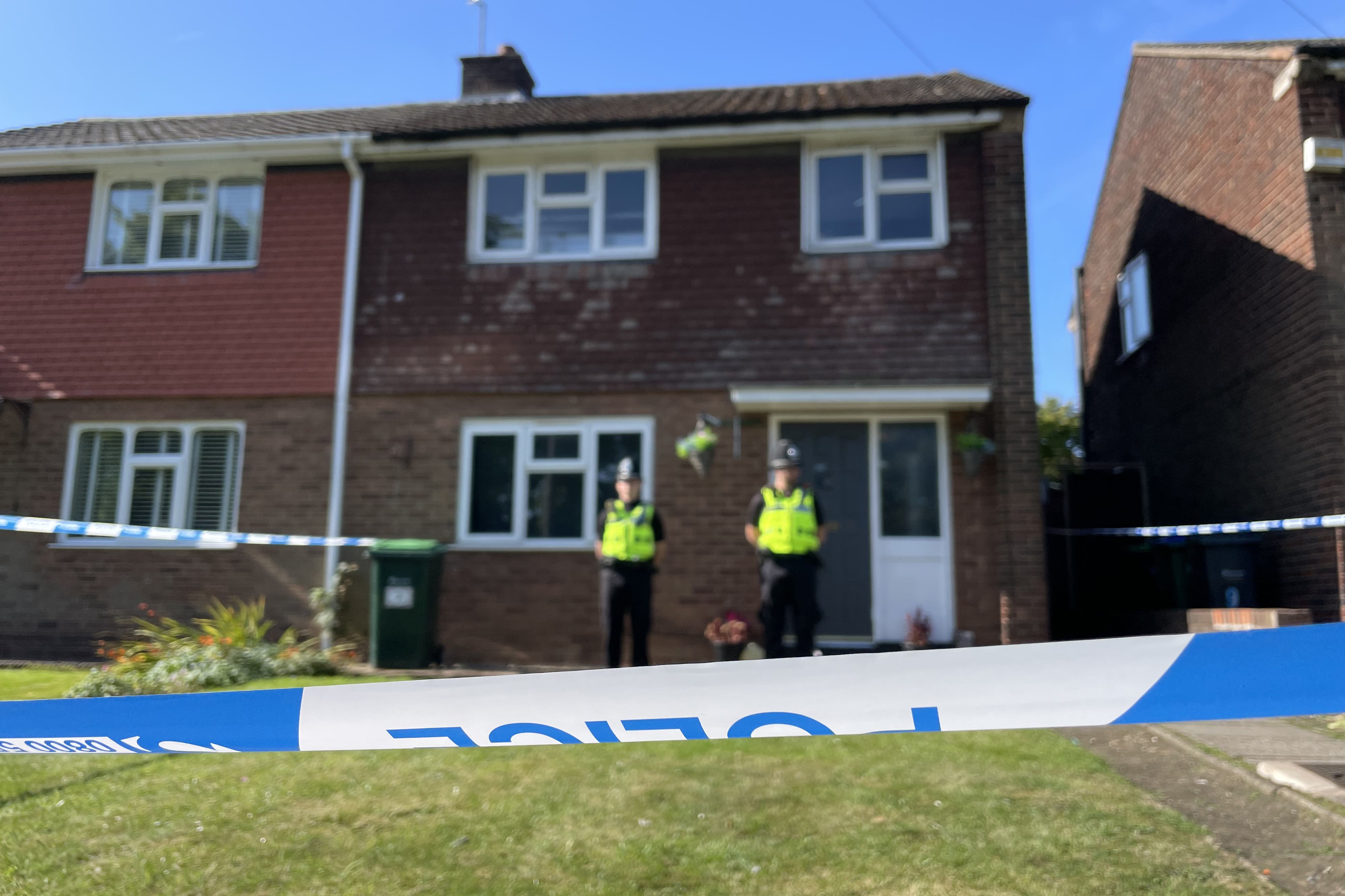 Police officers at the scene in Lovett Avenue, Oldbury after a 13-year-old boy was stabbed to death (Phil Barnett/PA)