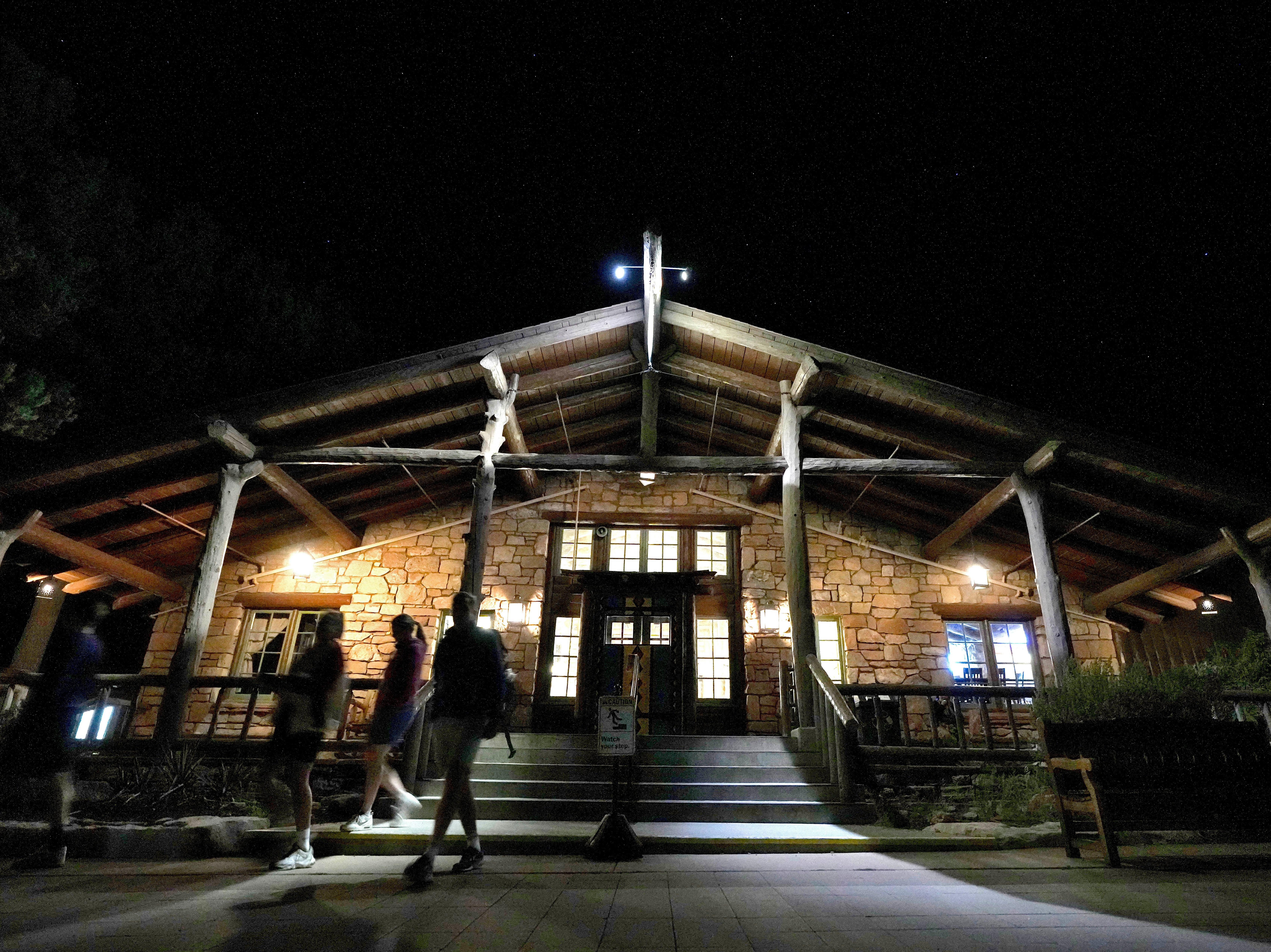 Guests leave the Bright Angel Lodge on 28 August in Grand Canyon after a series of breaks in the water pipeline on the park