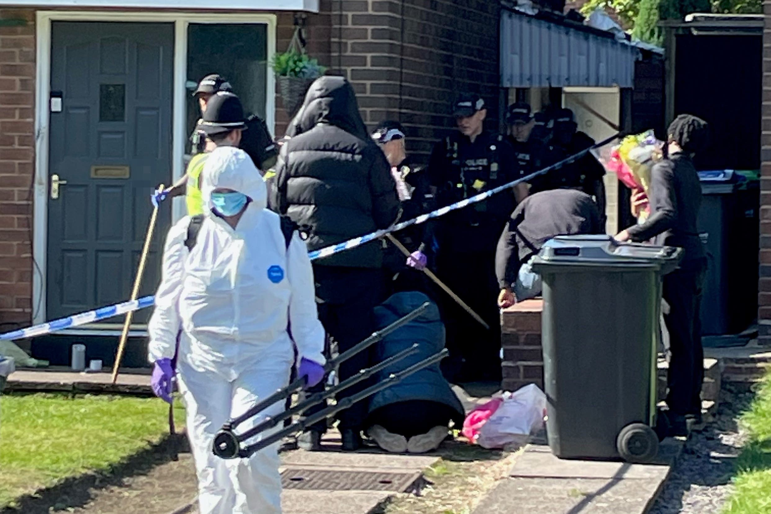 Police officers at the scene in Lovett Avenue, Oldbury after a 13-year-old boy was stabbed to death at a house, sparking a murder investigation