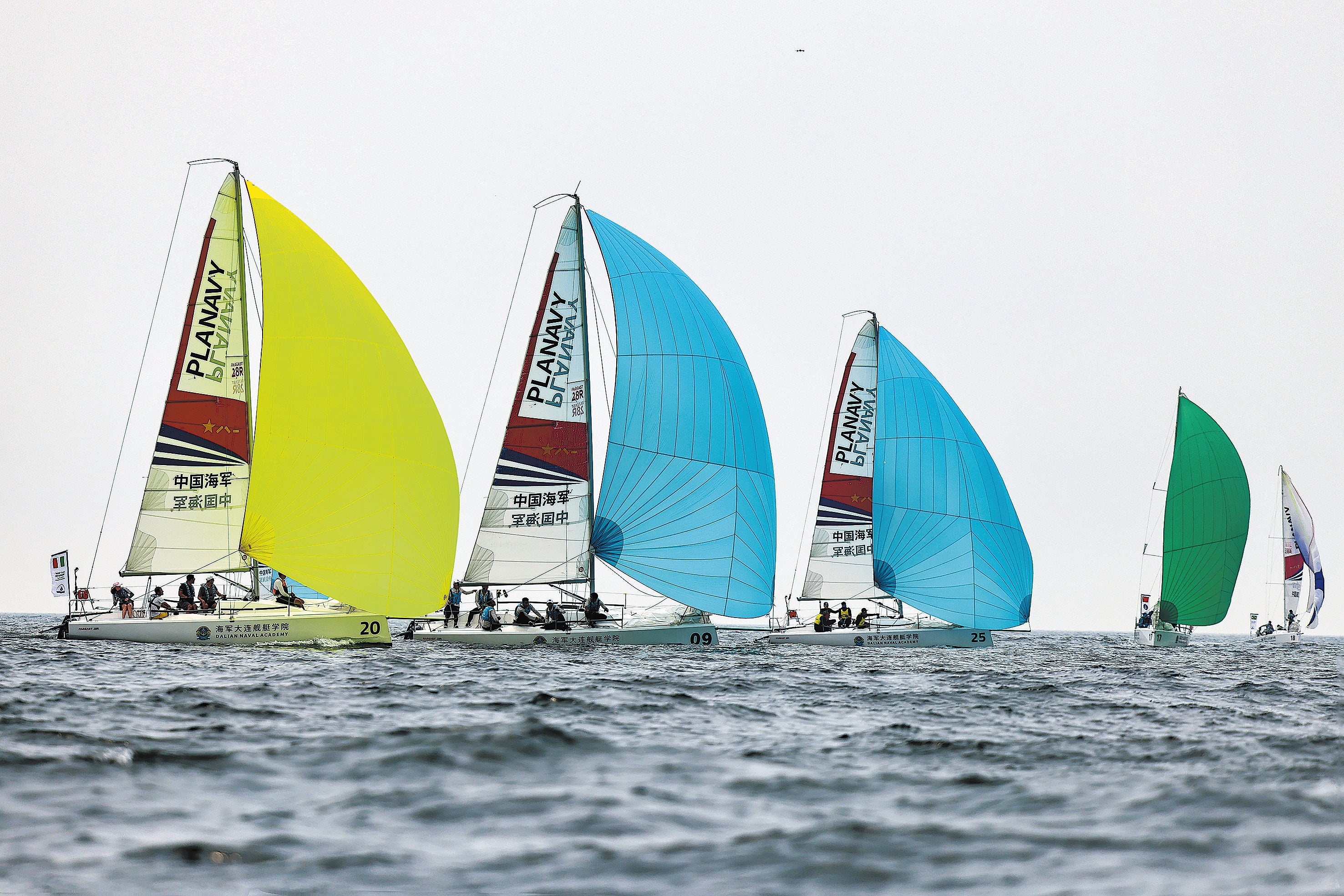 Boats from various countries compete in the first Navy Cup International Sailing Regatta in Dalian, Liaoning province, in July