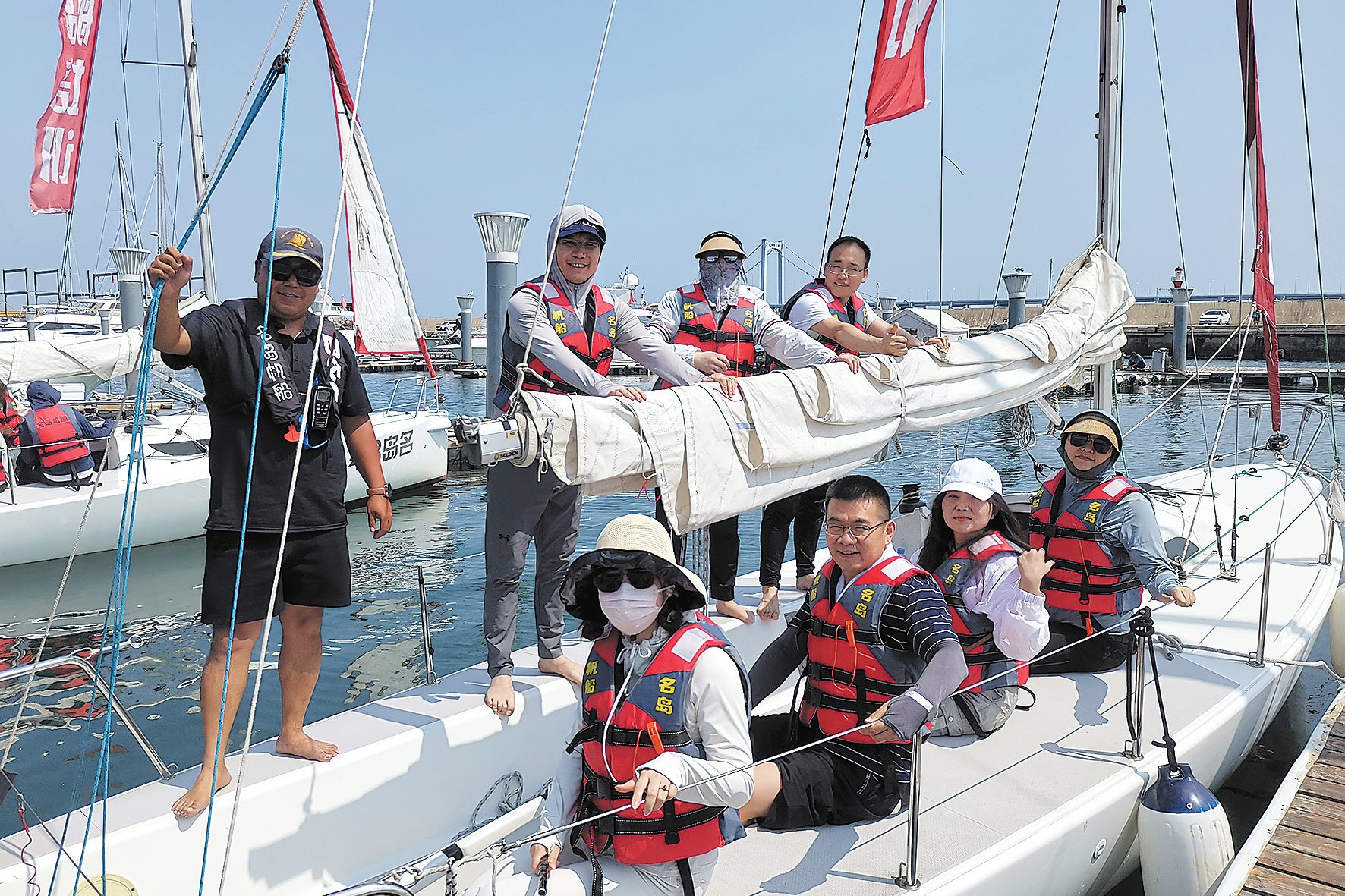 A sailing coach with his students at the Xinghai Bay Yacht Harbour in Dalian in June