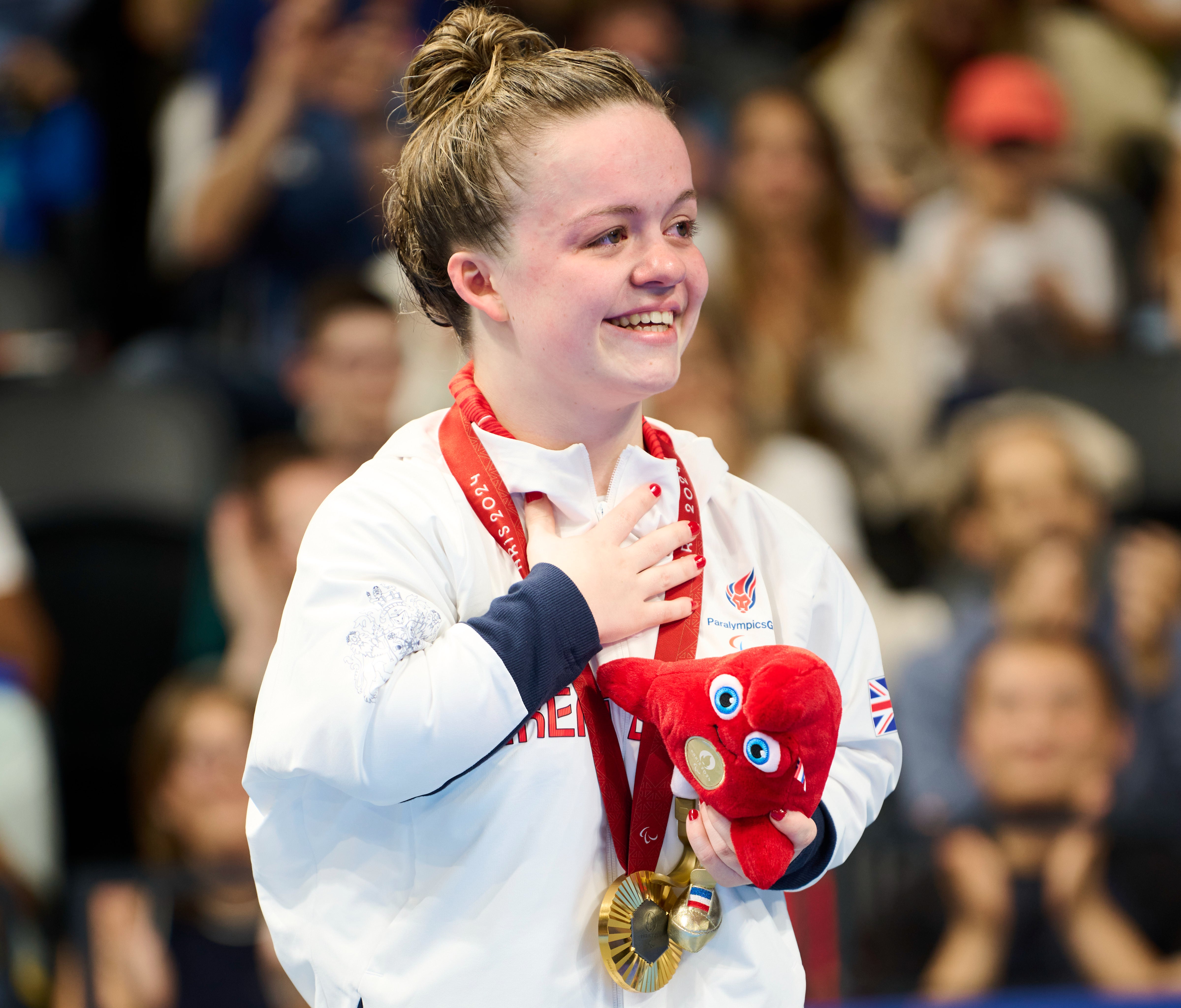 Maisie Summers-Newton celebrates her gold medal