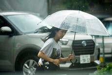 Storm slowly heads toward Japan's capital, leaving mudslides and broken bridges in its path