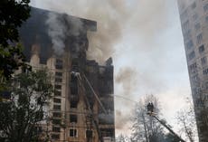 Ukrainian residential building burns after Russian attack on Kharkiv kills seven