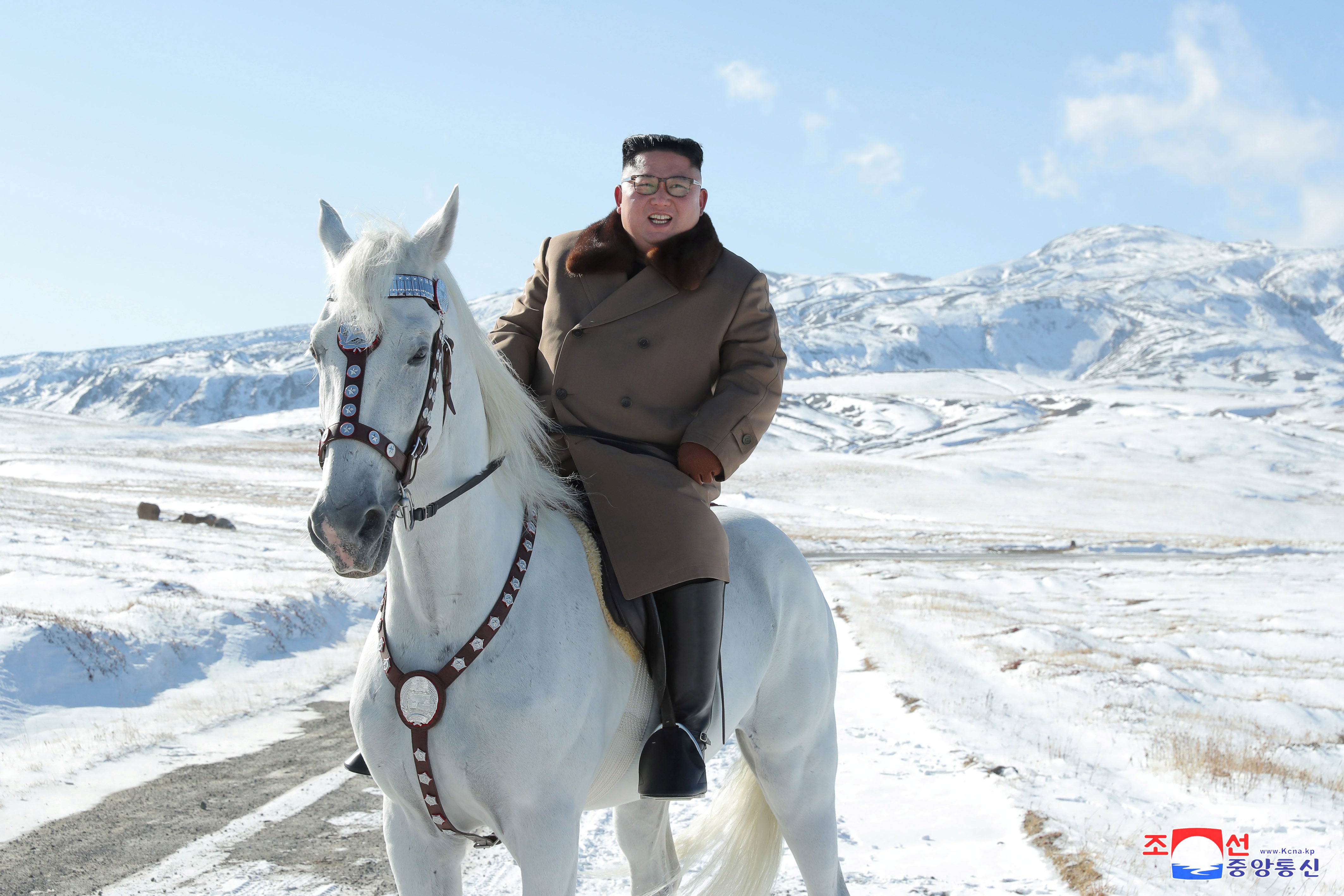 Kim Jong-un rides a horse during snowfall in Mount Paektu in 2019