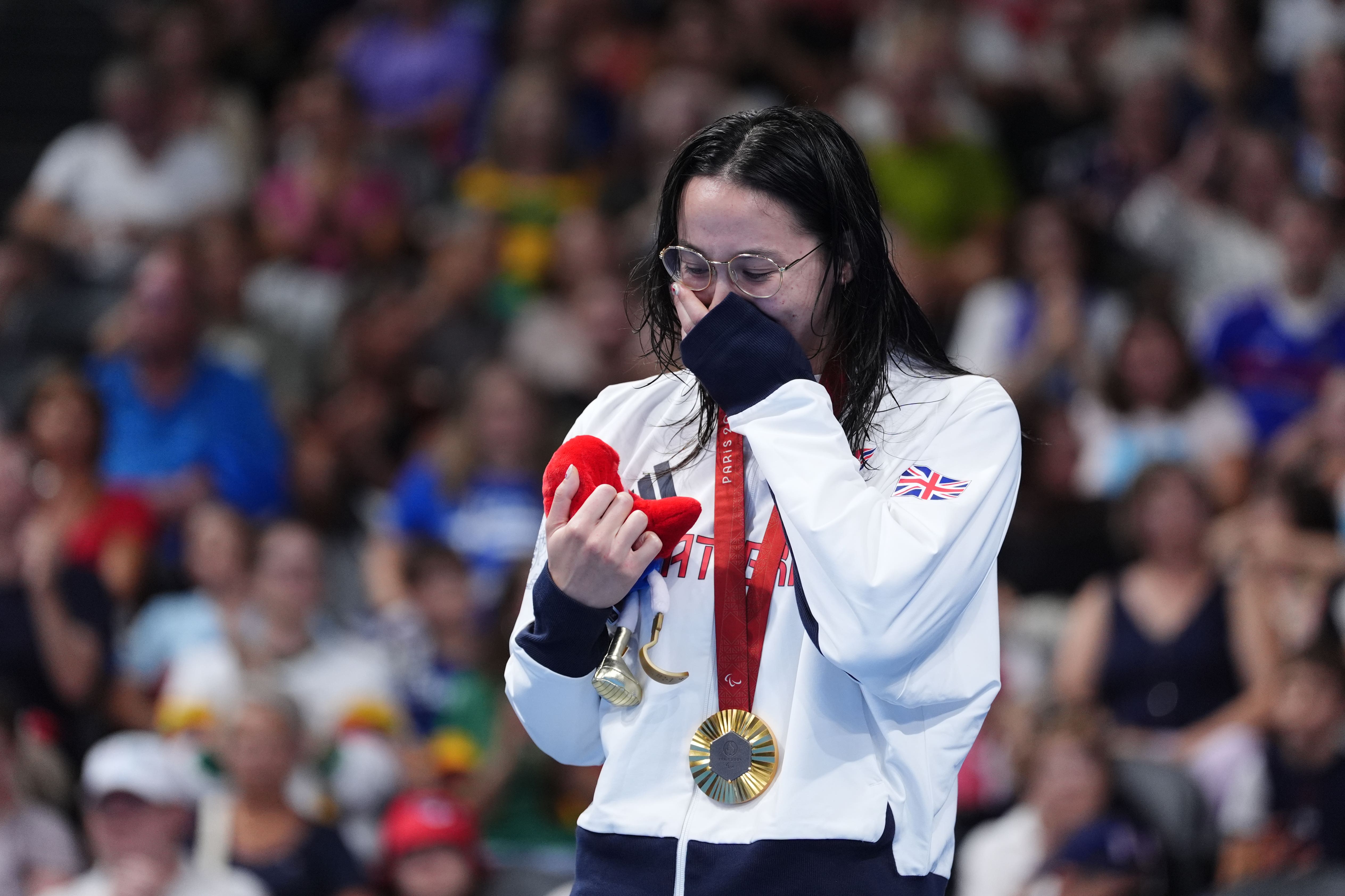 Great Britain’s Alice Tai on the podium with the gold medal after winning the Women’s 100m Backstroke – S8 Final at the Paris La Defense Arena on day three of the Paris 2024 Summer Paralympic Games. Picture date: Saturday August 31, 2024.