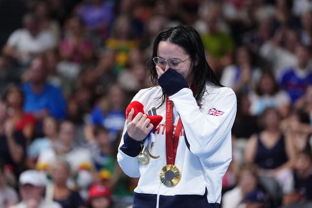 Great Britain’s Alice Tai on the podium with the gold medal after winning the Women’s 100m Backstroke – S8 Final at the Paris La Defense Arena on day three of the Paris 2024 Summer Paralympic Games. Picture date: Saturday August 31, 2024.