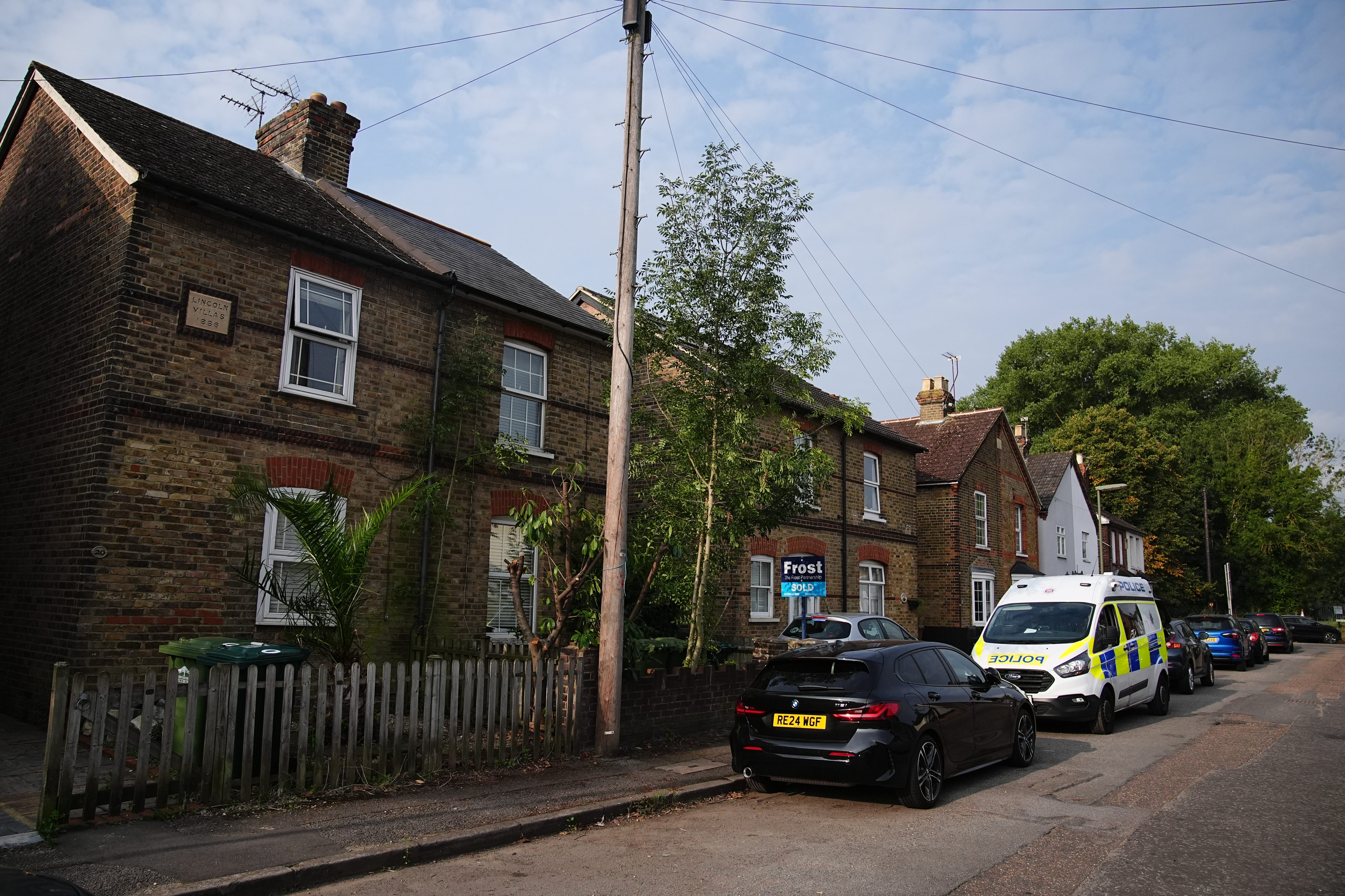 Police in Bremer Road, Staines-Upon-Thames near a property where three children and a man were found dead (Aaron Chown/PA)