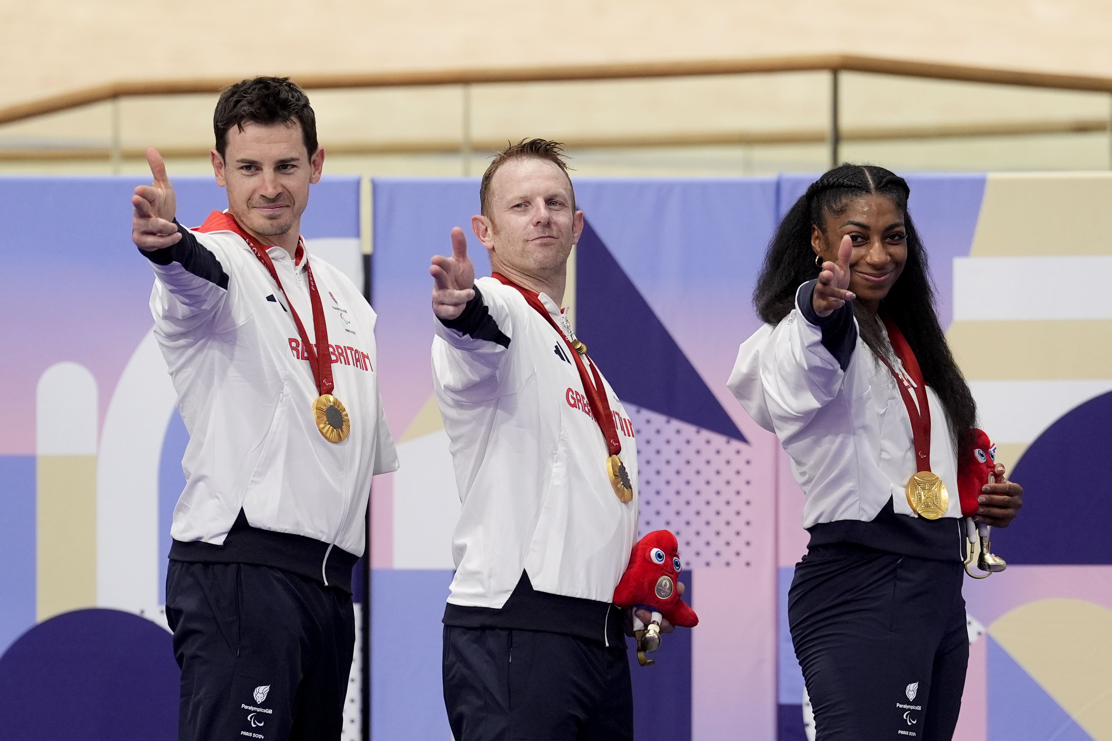 Kadeena Cox, right, secured Paralympic redemption alongside Jaco van Gass and Jody Cundy (Andrew Matthews/PA)