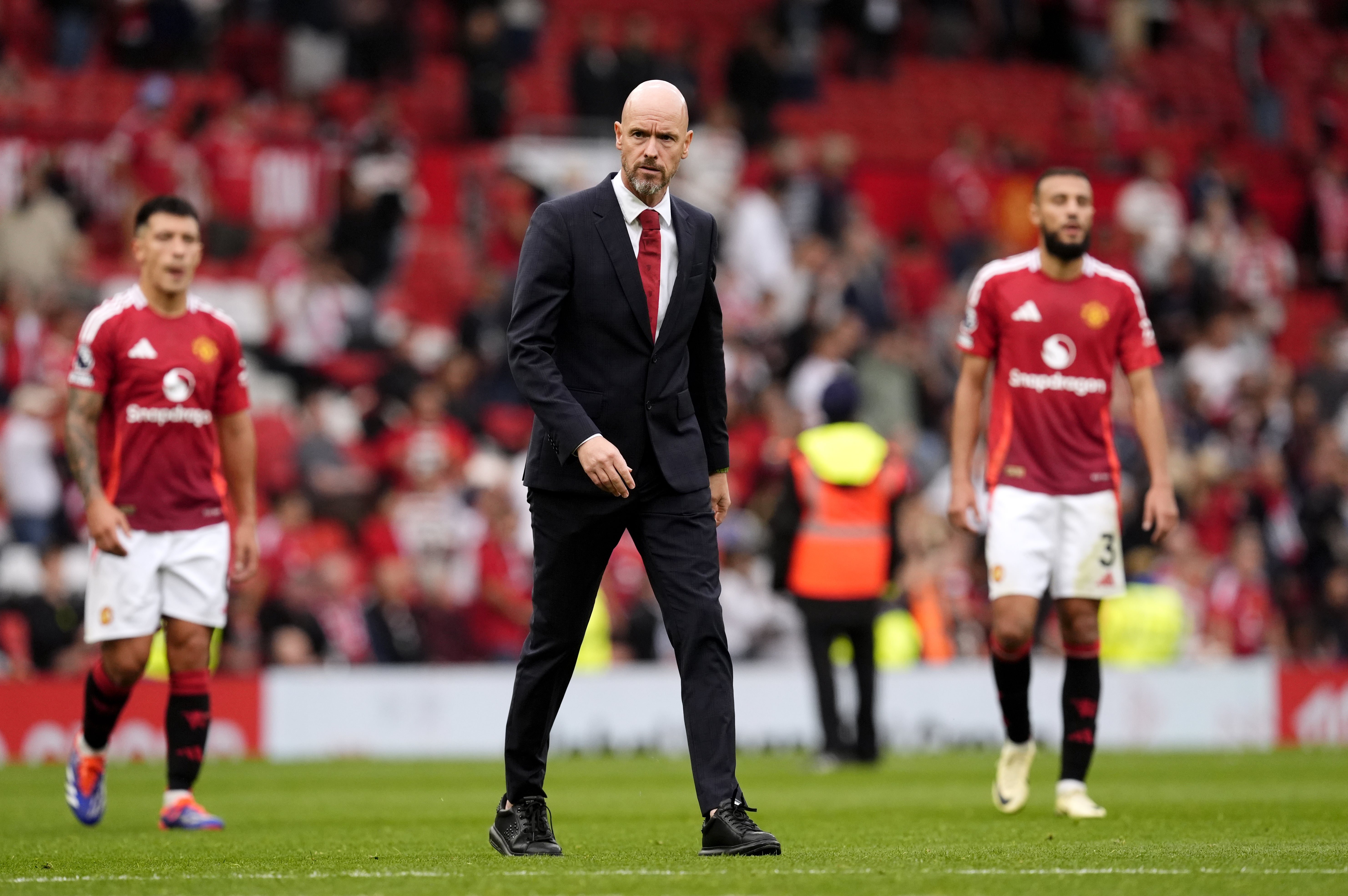 Manchester United manager Erik ten Hag walks off dejected