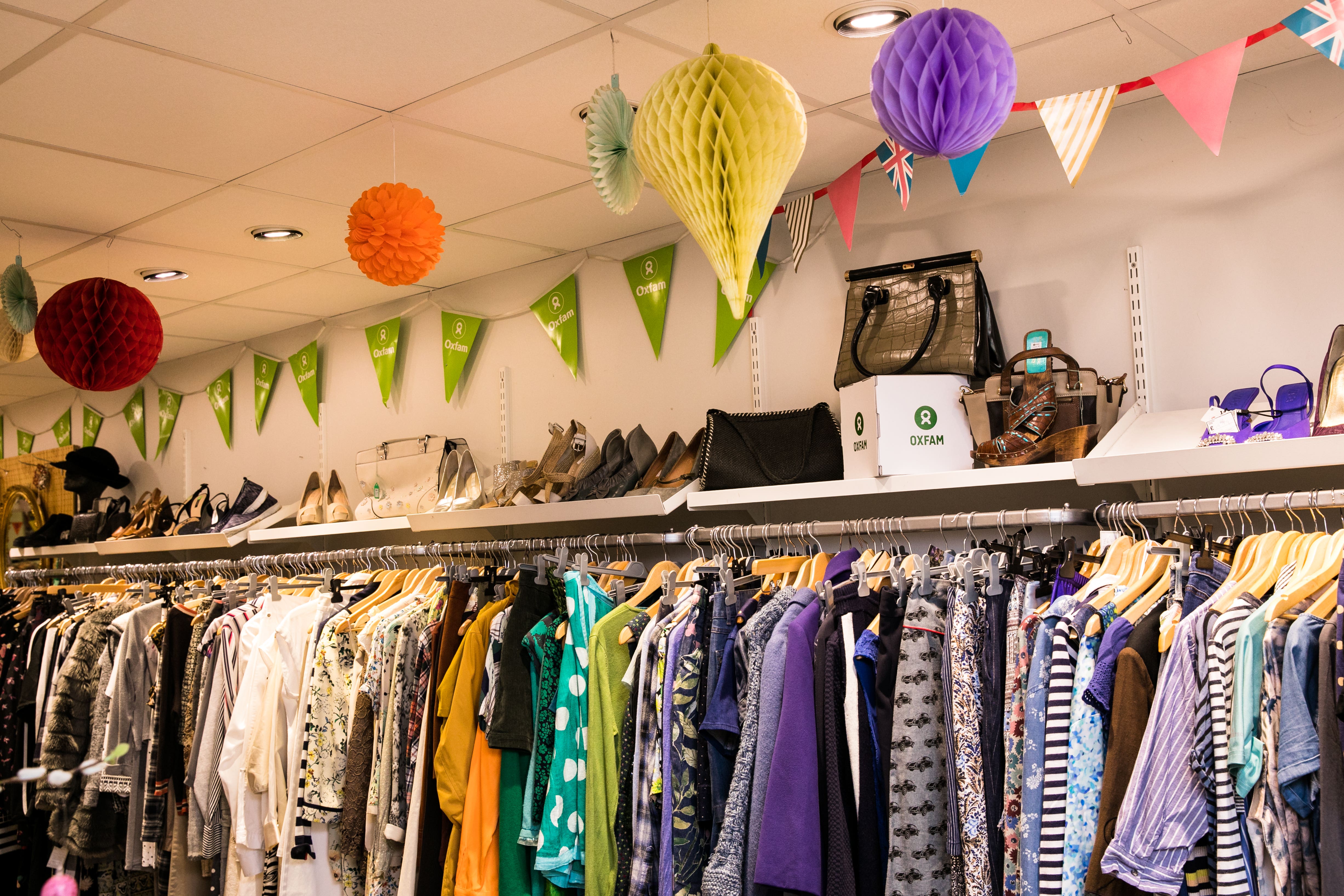 <p>Donated clothing on display in an Oxfam shop in Brighton and Hove </p>
