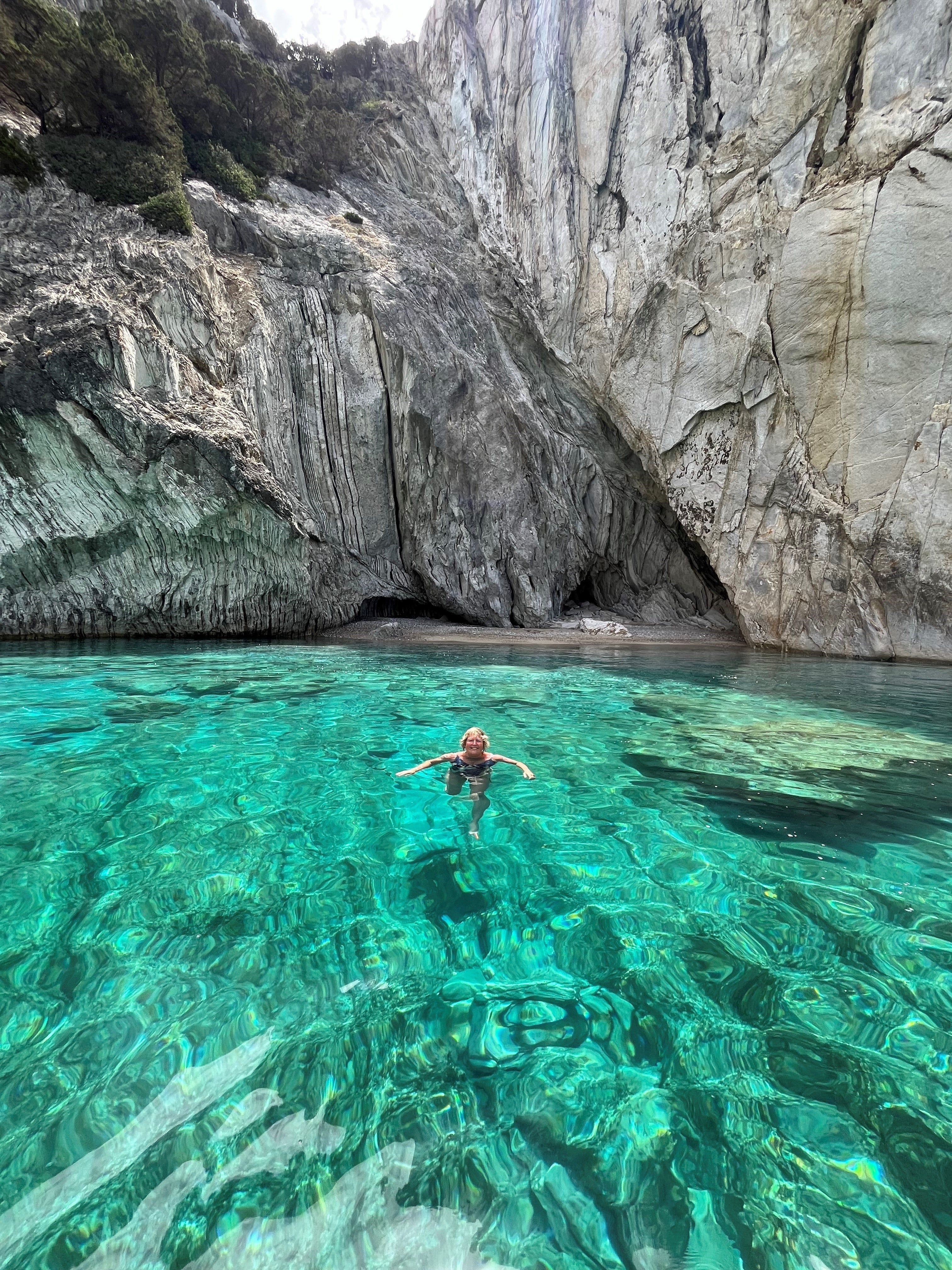 Dive in: The writer swimming from a boat off Meganisi