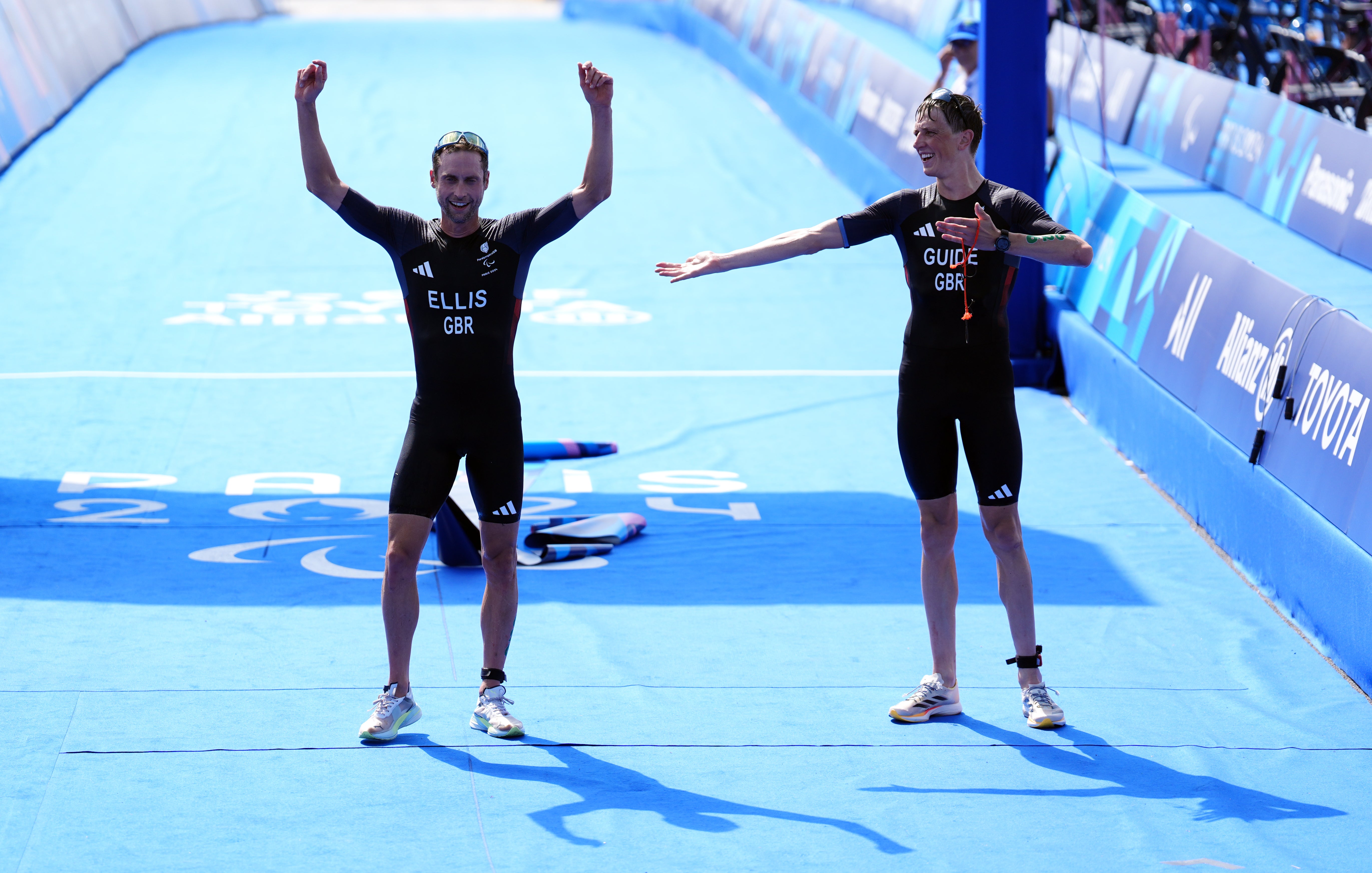 Dave Ellis celebrates with guide Luke Pollard