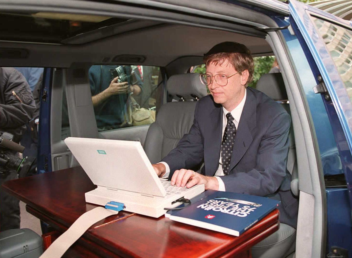 Bill Gates demonstrating Microsoft’s Windows 95 from his car ahead of a Paris press conference in September 1995