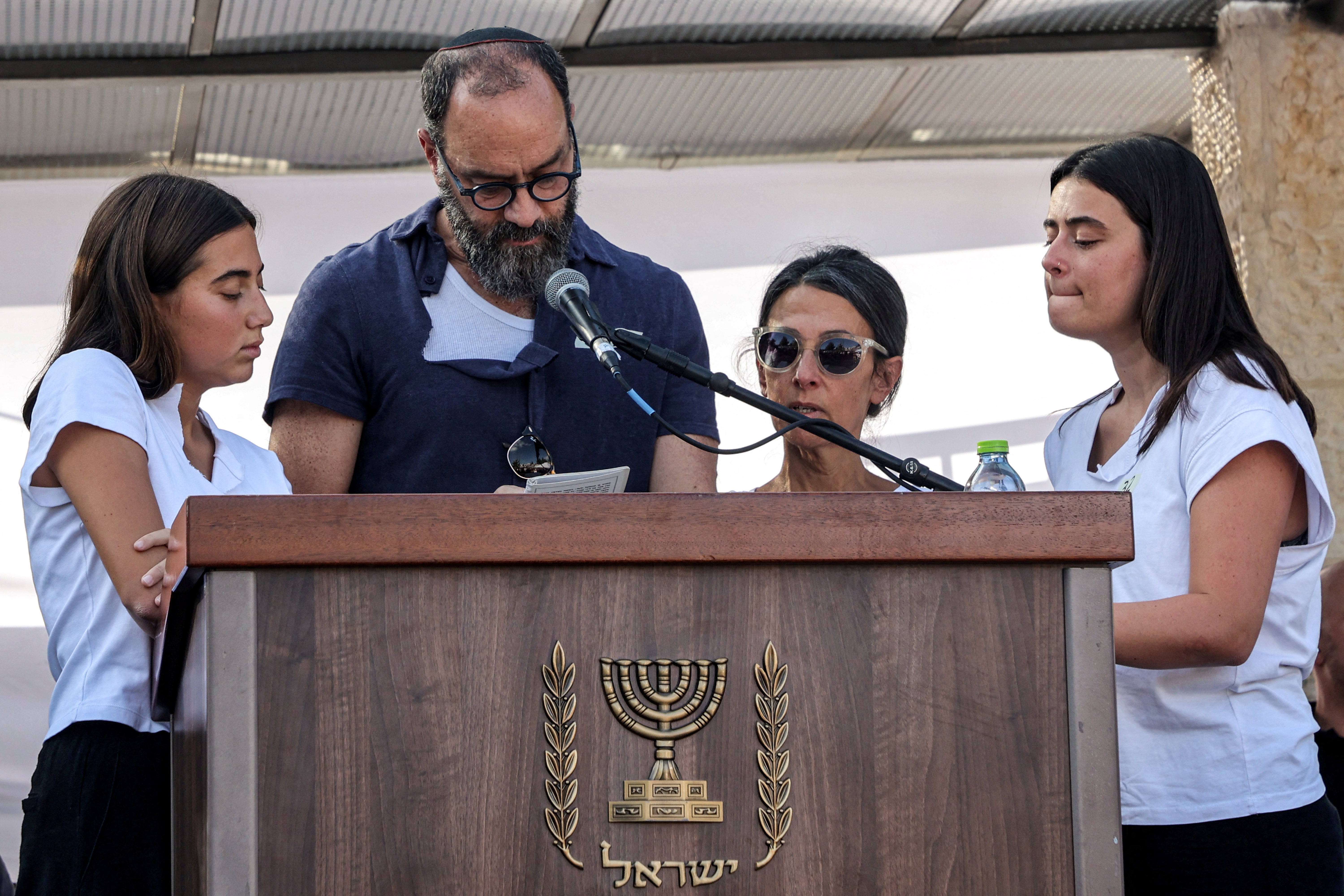 Jonathan Polin supported by family at the funeral of his son Hersh Goldberg-Polin on Monday