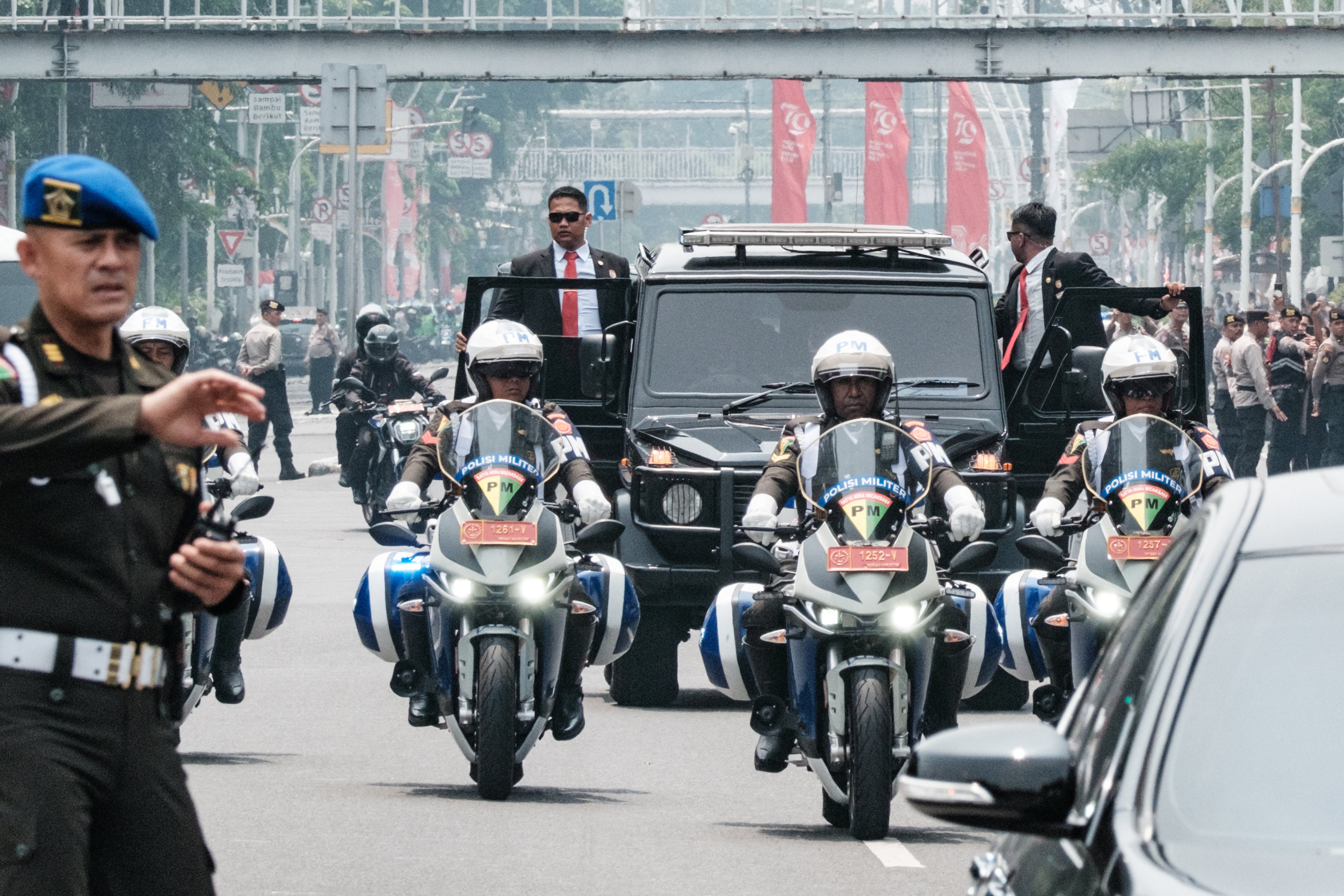 Security guards lead the motorcade of Pope Francis near the Vatican embassy in Jakarta, Indonesia, on Tuesday