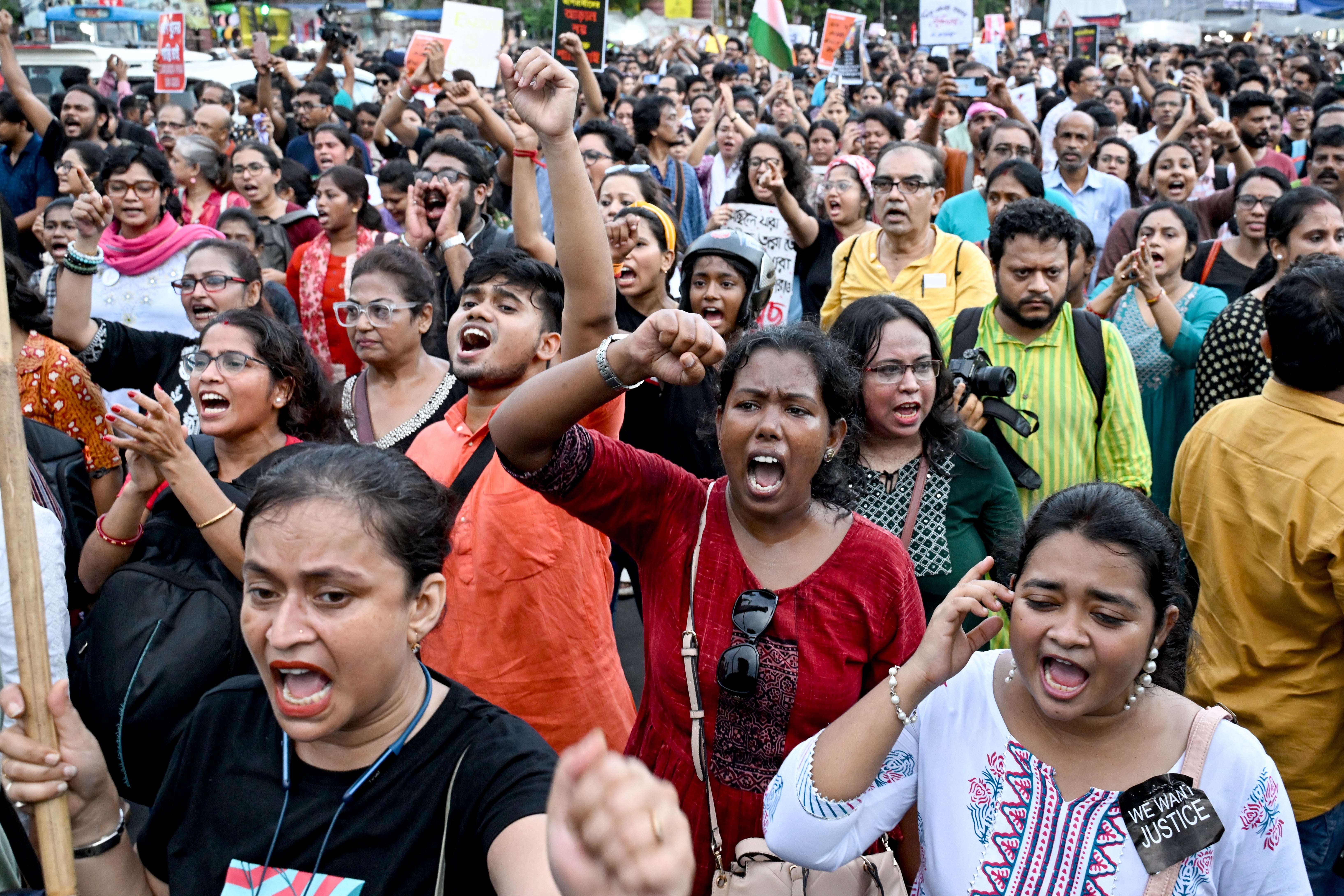 Social activists and students shout slogans during a protest march against the rape and murder of a doctor in Kolkata