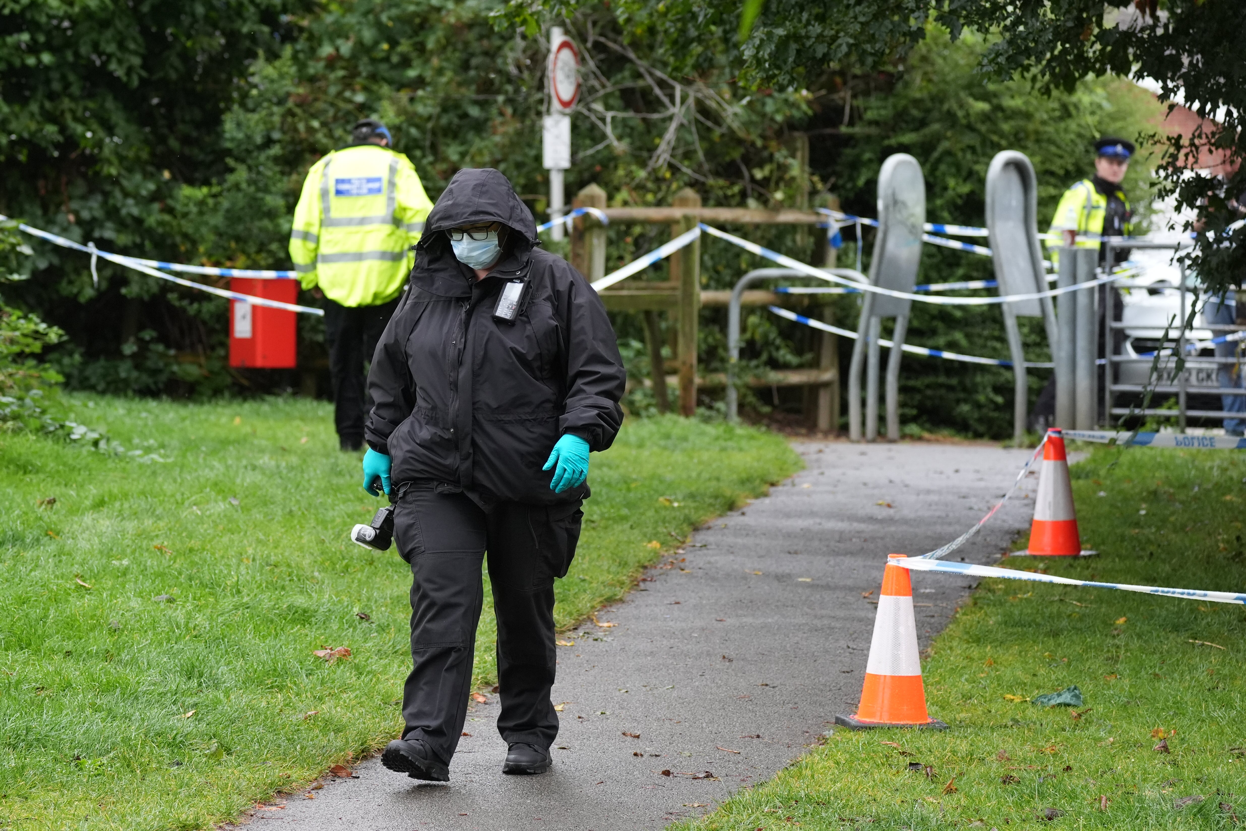 Officers investigate at the scene of the attack in Franklin Park