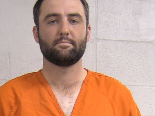 In this mug shot provided by the Louisville Metropolitan Department of Corrections Friday, May 17, 2024, Scottie Scheffler is shown. Scheffler was detained by police Friday morning on his way to the PGA Championship, with stunning images showing him handcuffed as he was led to a police car. The charges later were dropped