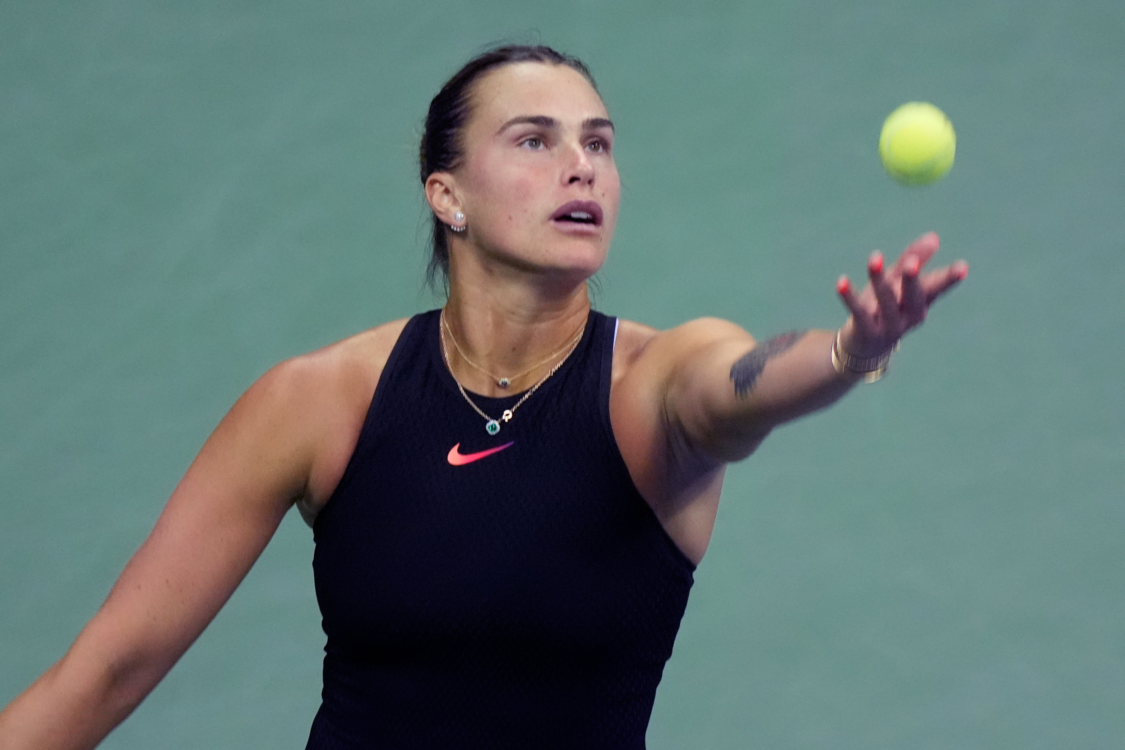 Aryna Sabalenka of Belarus serves against Zheng Qinwen of China in the quarterfinals of the U.S. Open, Tuesday, Sept. 3, 2024, in New York. (AP Photo/Eduardo Munoz Alvarez)