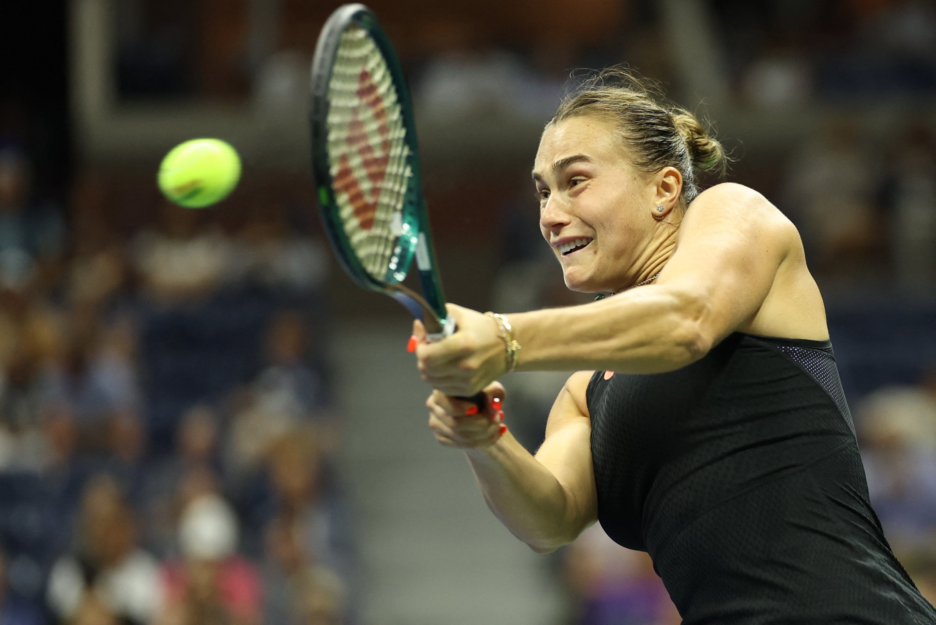 Belarus' Aryna Sabalenka returns a serve to China's Zheng Qinwen during their women's singles quarterfinal match on day nine of the US Open tennis tournament at the USTA Billie Jean King National Tennis Center in New York City on September 3, 2024. (Photo by CHARLY TRIBALLEAU / AFP) (Photo by CHARLY TRIBALLEAU/AFP via Getty Images)