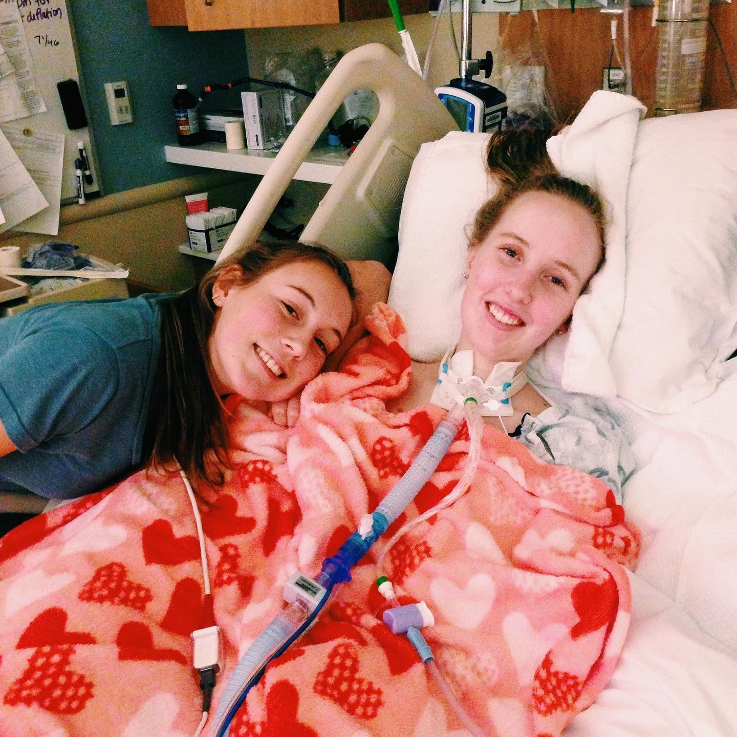 Grace in hospital with her sister Emily