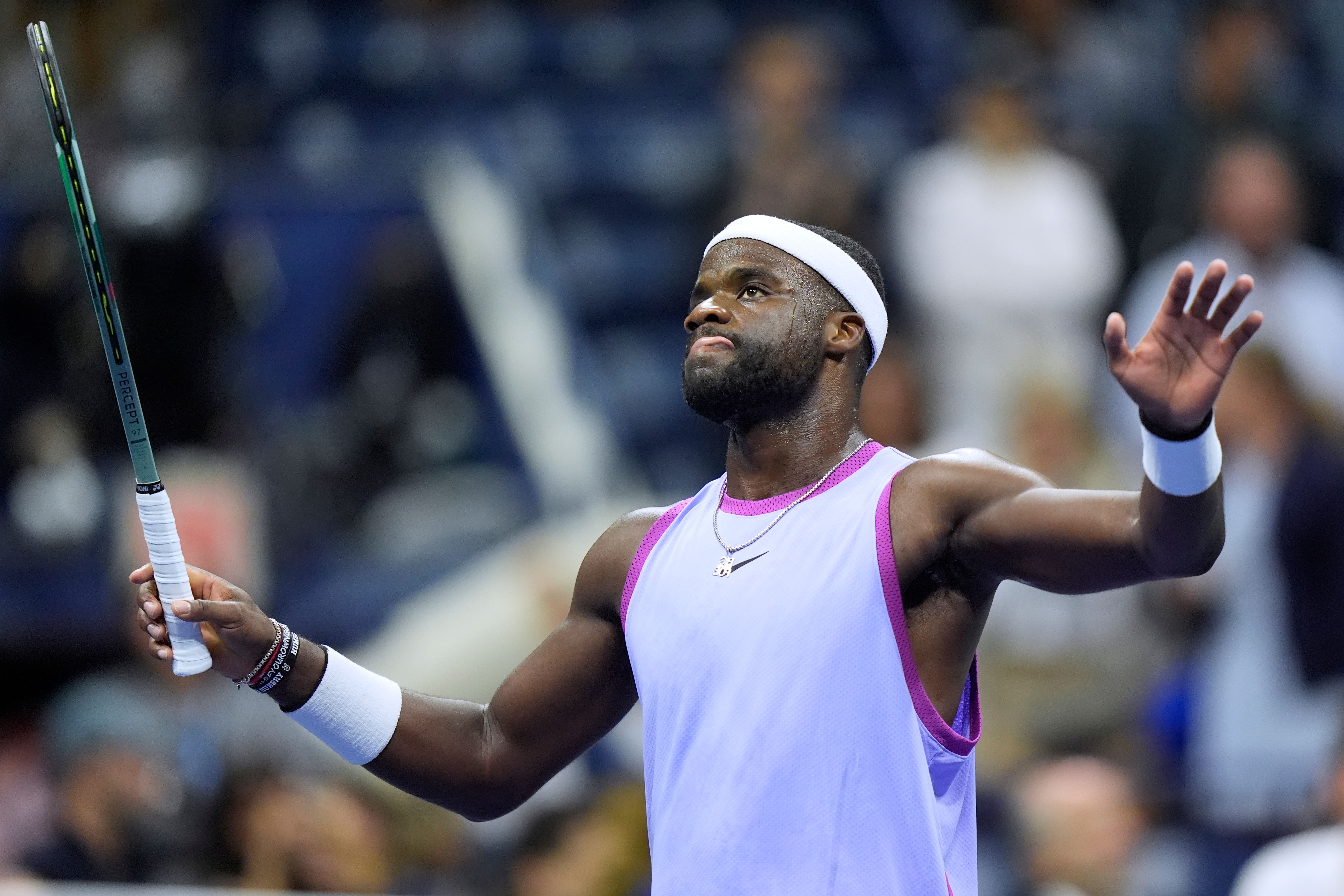 Frances Tiafoe, of the United States, acknowledges the crowd after defeating Grigor Dimitrov, of Bulgaria, (Eduardo Munoz Alvarez/AP)