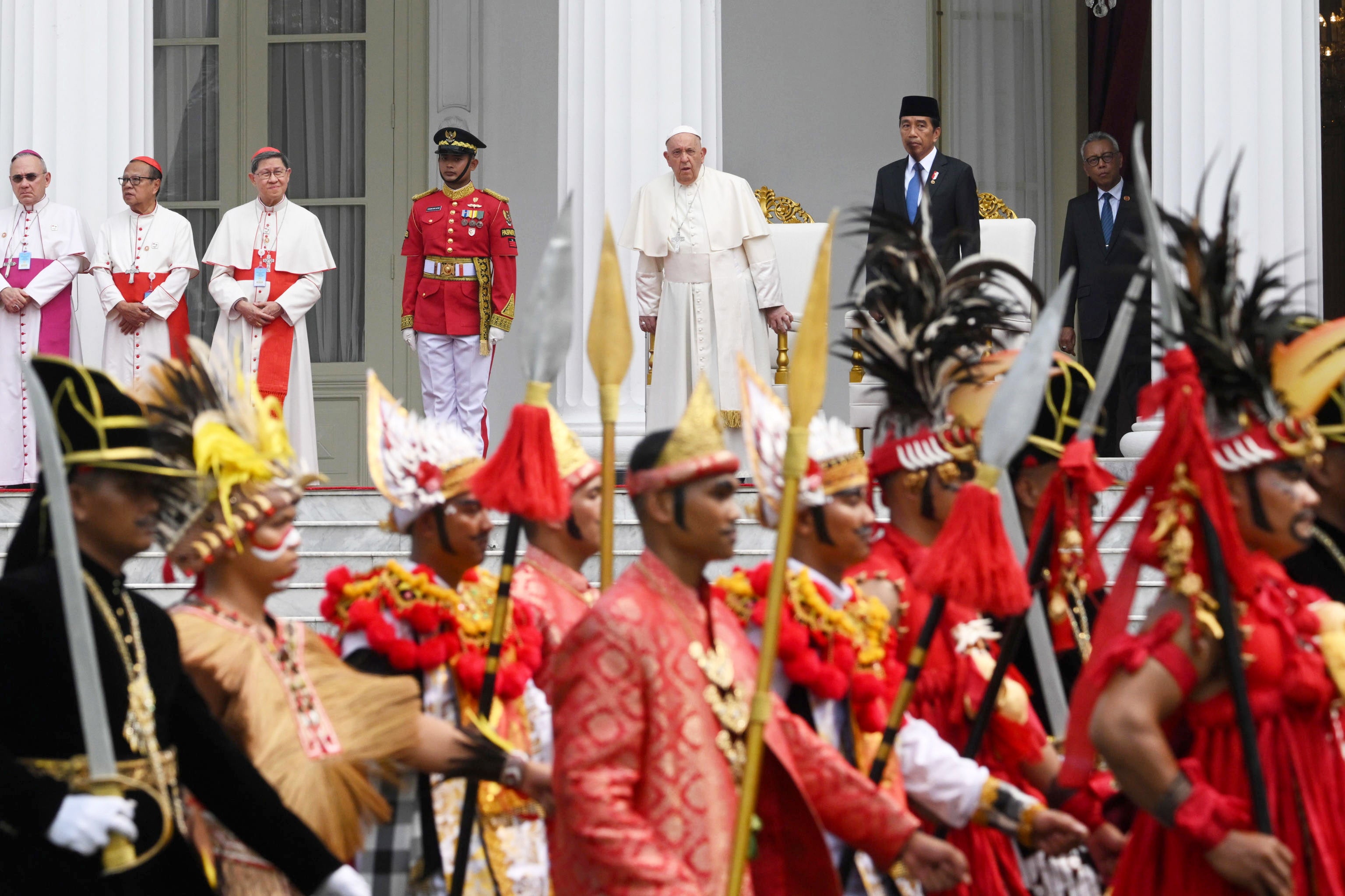 Pope Francis and Indonesian president Joko Widodo attend a welcoming ceremony in Jakarta