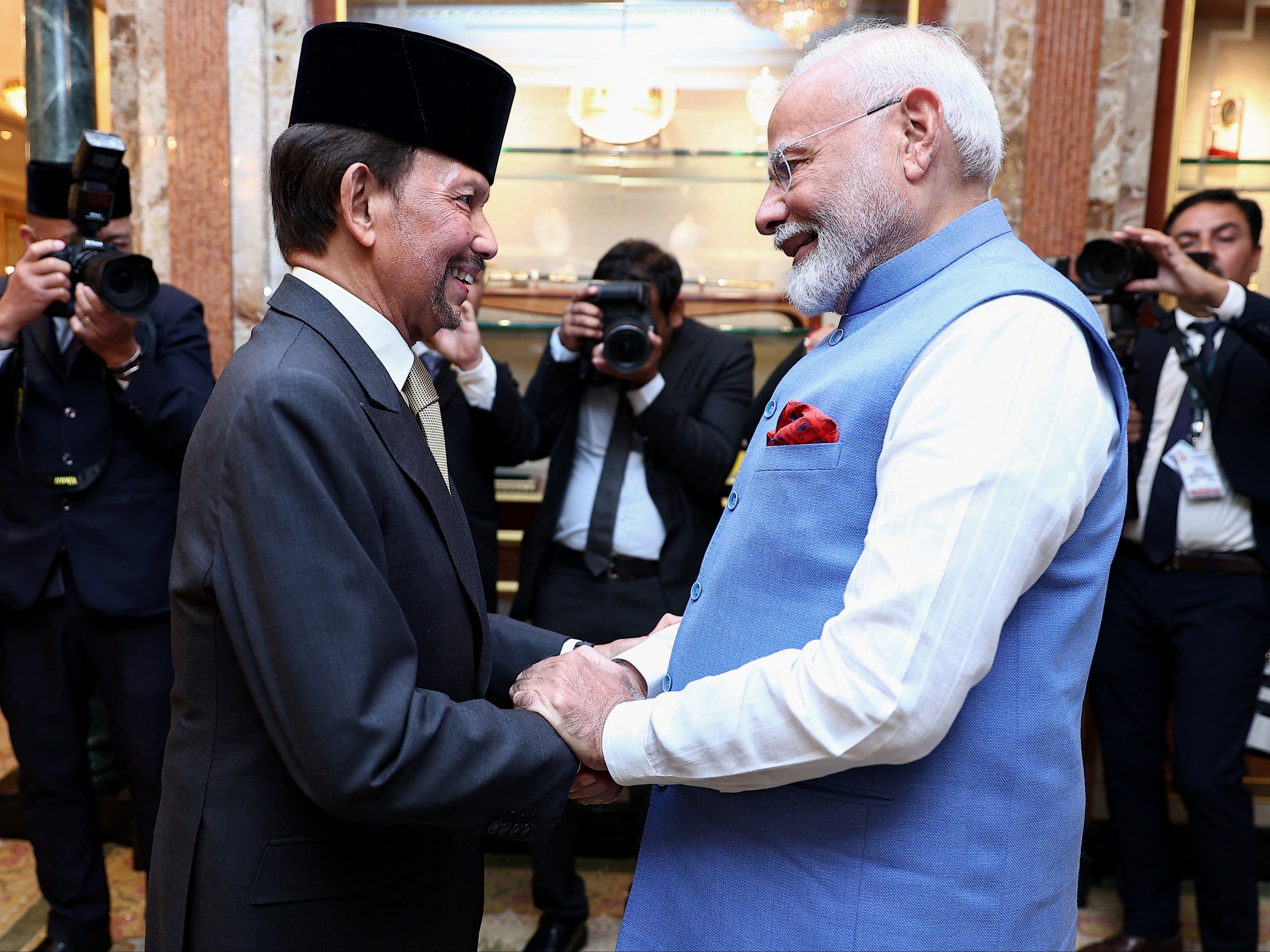 India’s prime minister Narendra Modi (R) shakes hands with Brunei Sultan Hassanal Bolkiah (L) prior to a meeting at Istana Nurul Iman in Bandar Seri Begawan on 4 September 2024