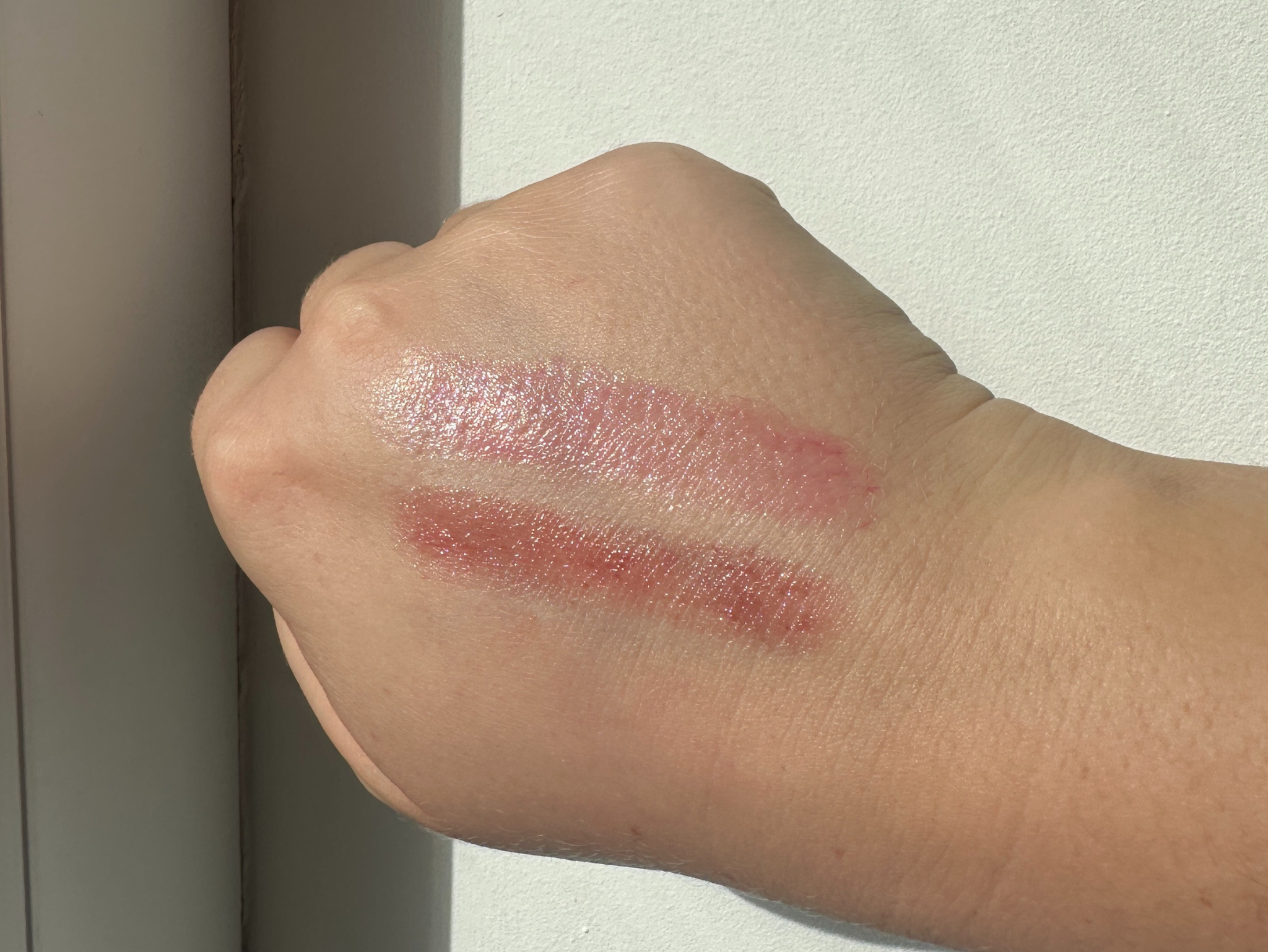 (Top) Nivea cherry shine lip balm and (bottom) Clinique black honey almost lipstick