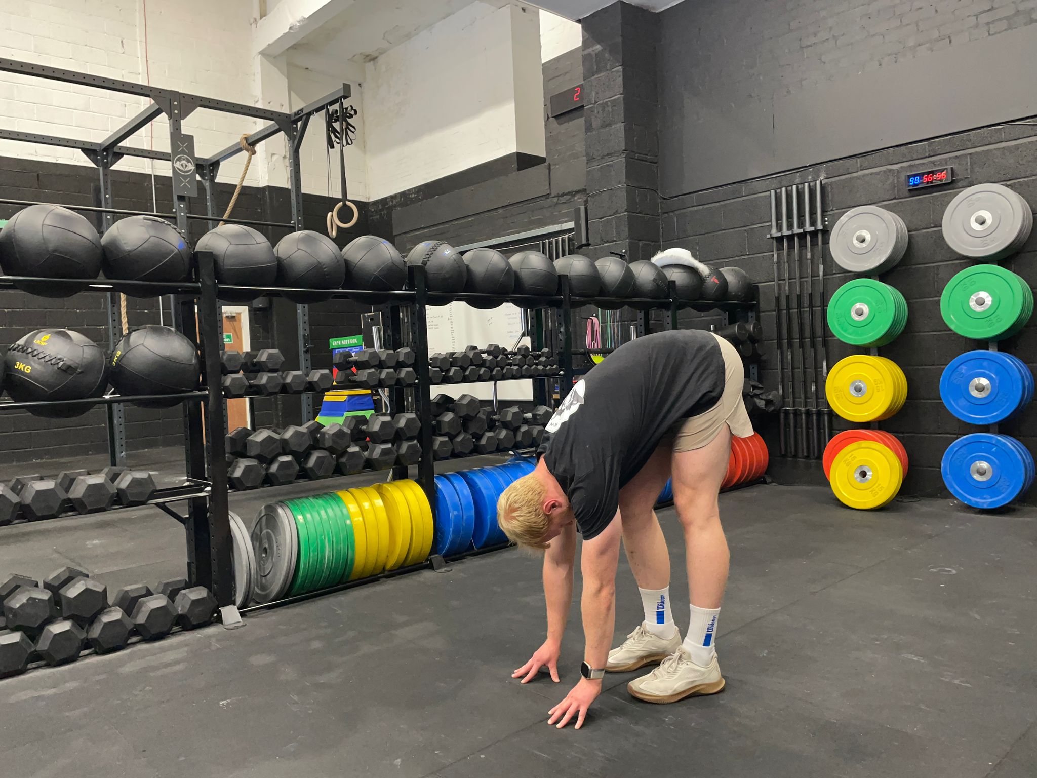 Fitness writer Harry Bullmore doing the elephant walk stretch