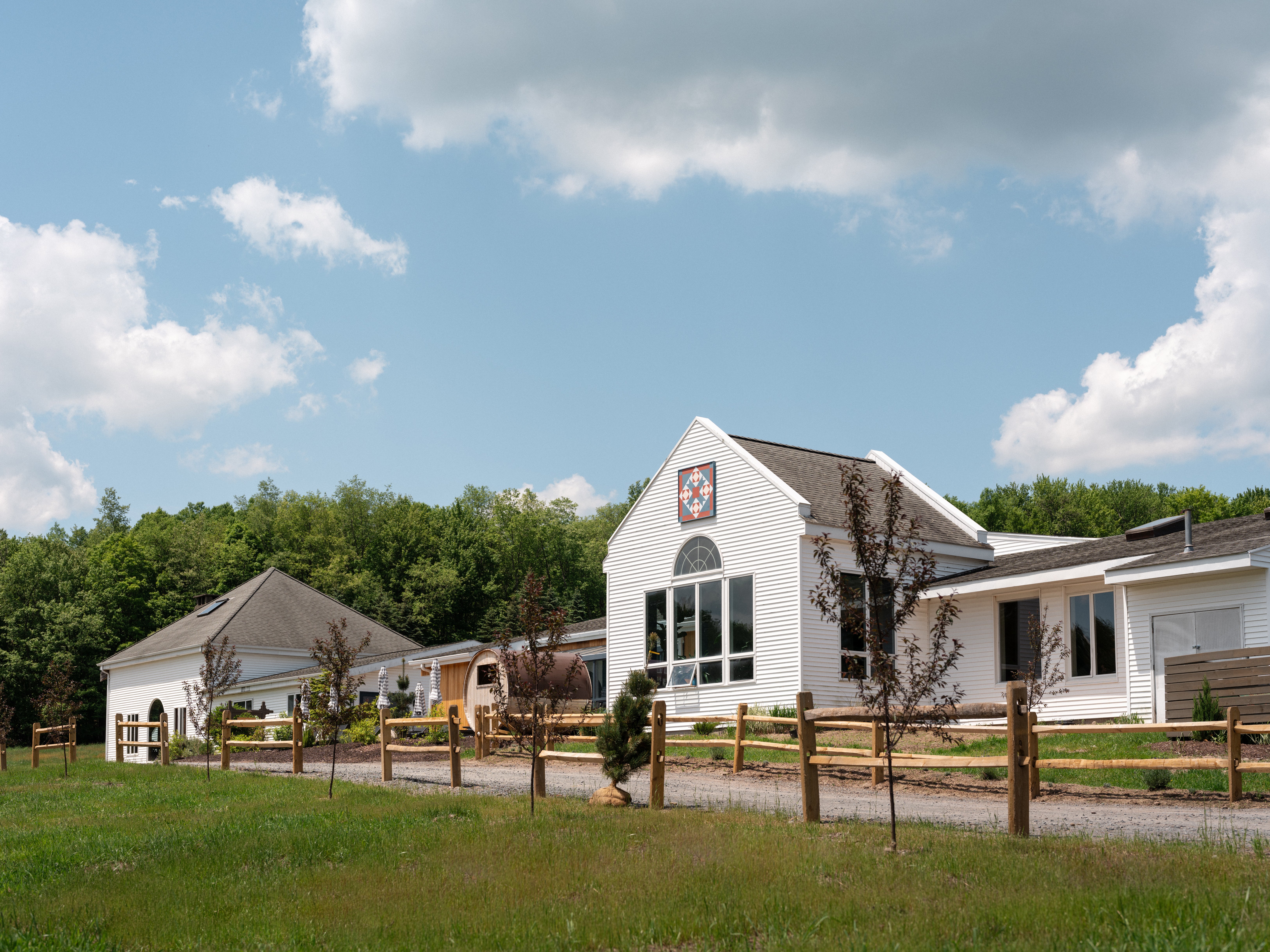 Hemlock Neversink rustic spa house and activity building with an outdoor sauna