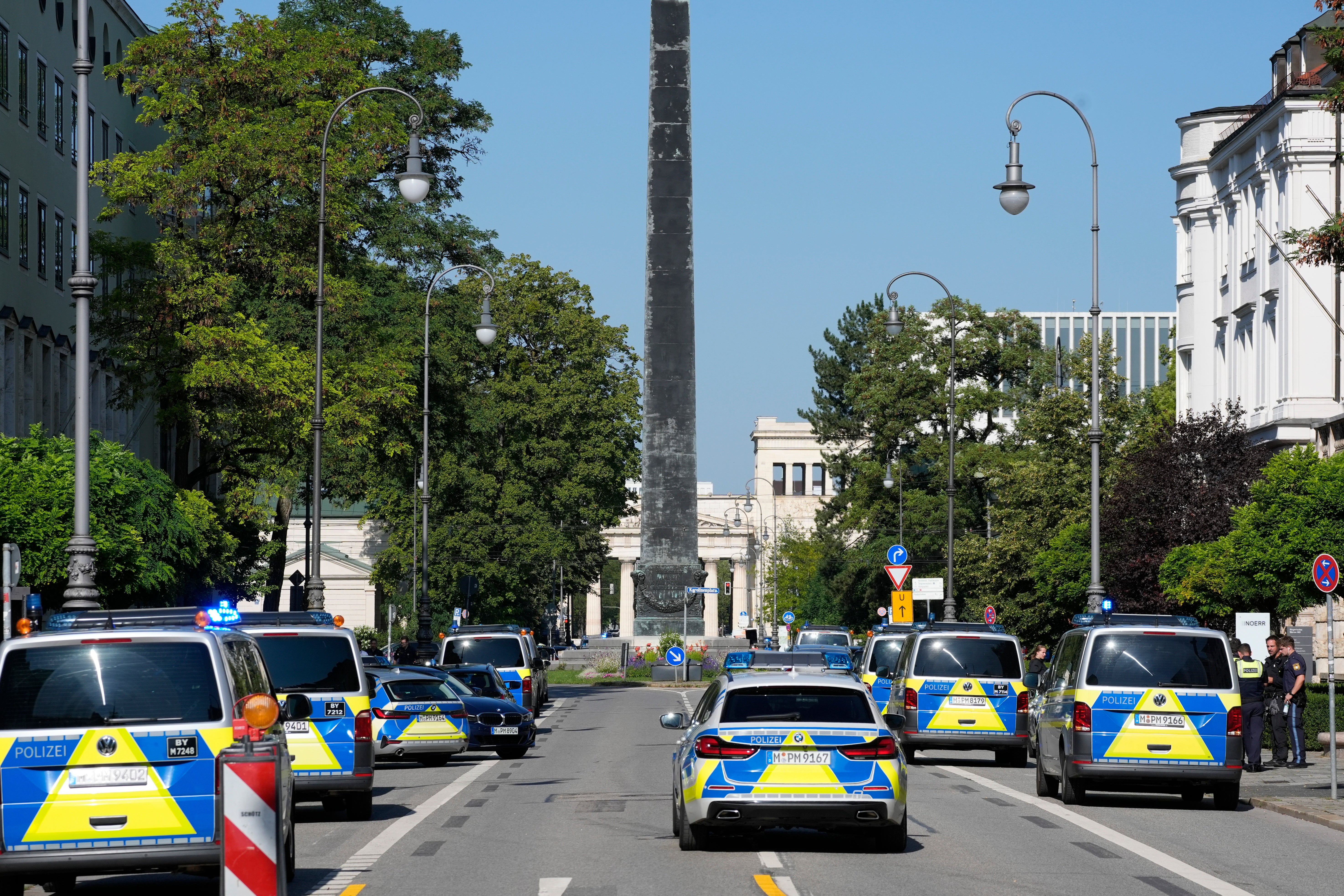 Police officers block a street after police said they fired shots at a suspicious person