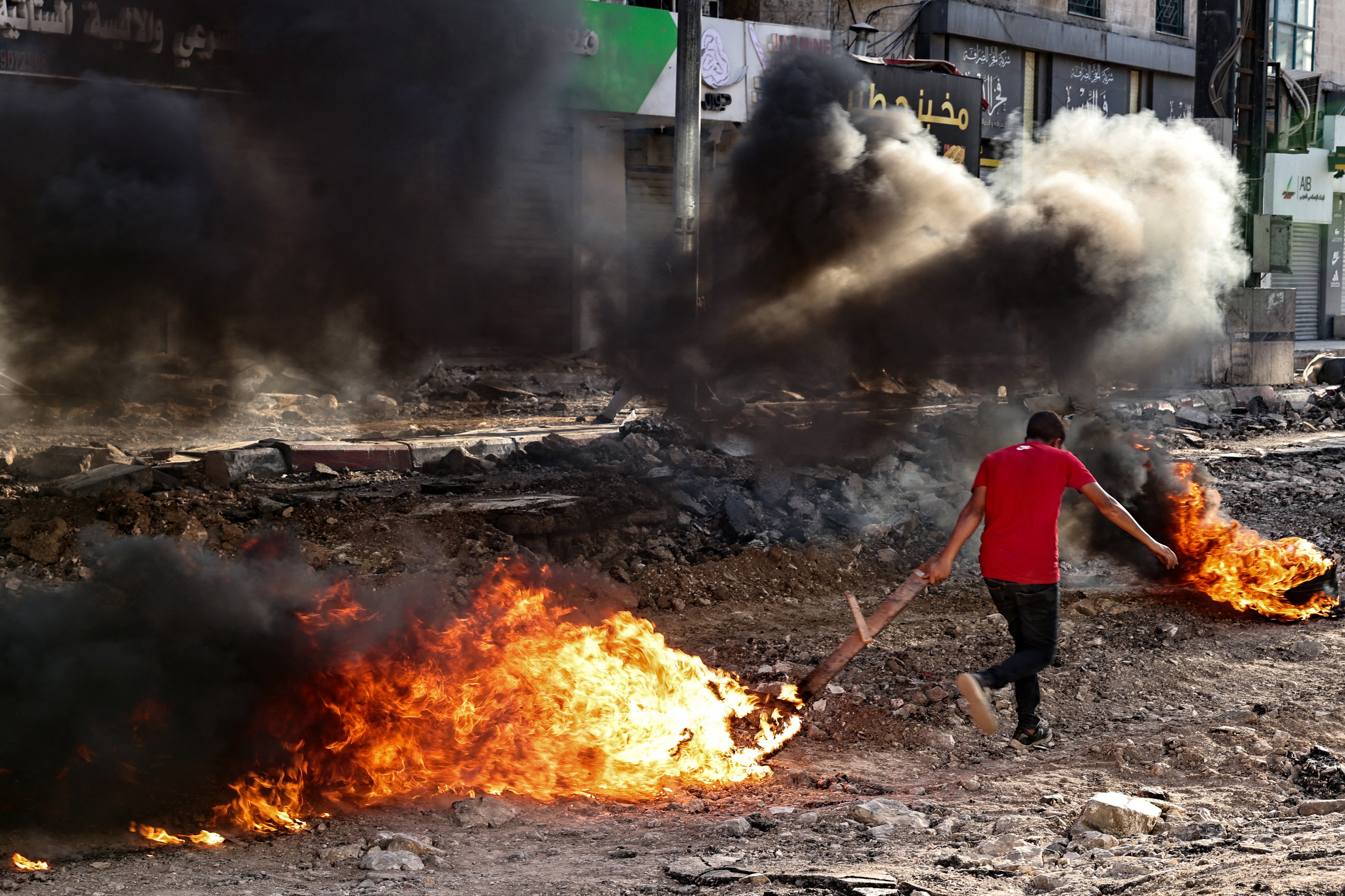 Jenin residents set tyres ablaze in an attempt to make raids by Israeli forces more difficult