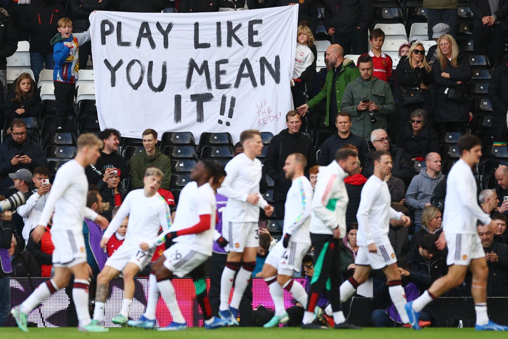 United fans display a banner to the players ahead of a visit to Fulham last season