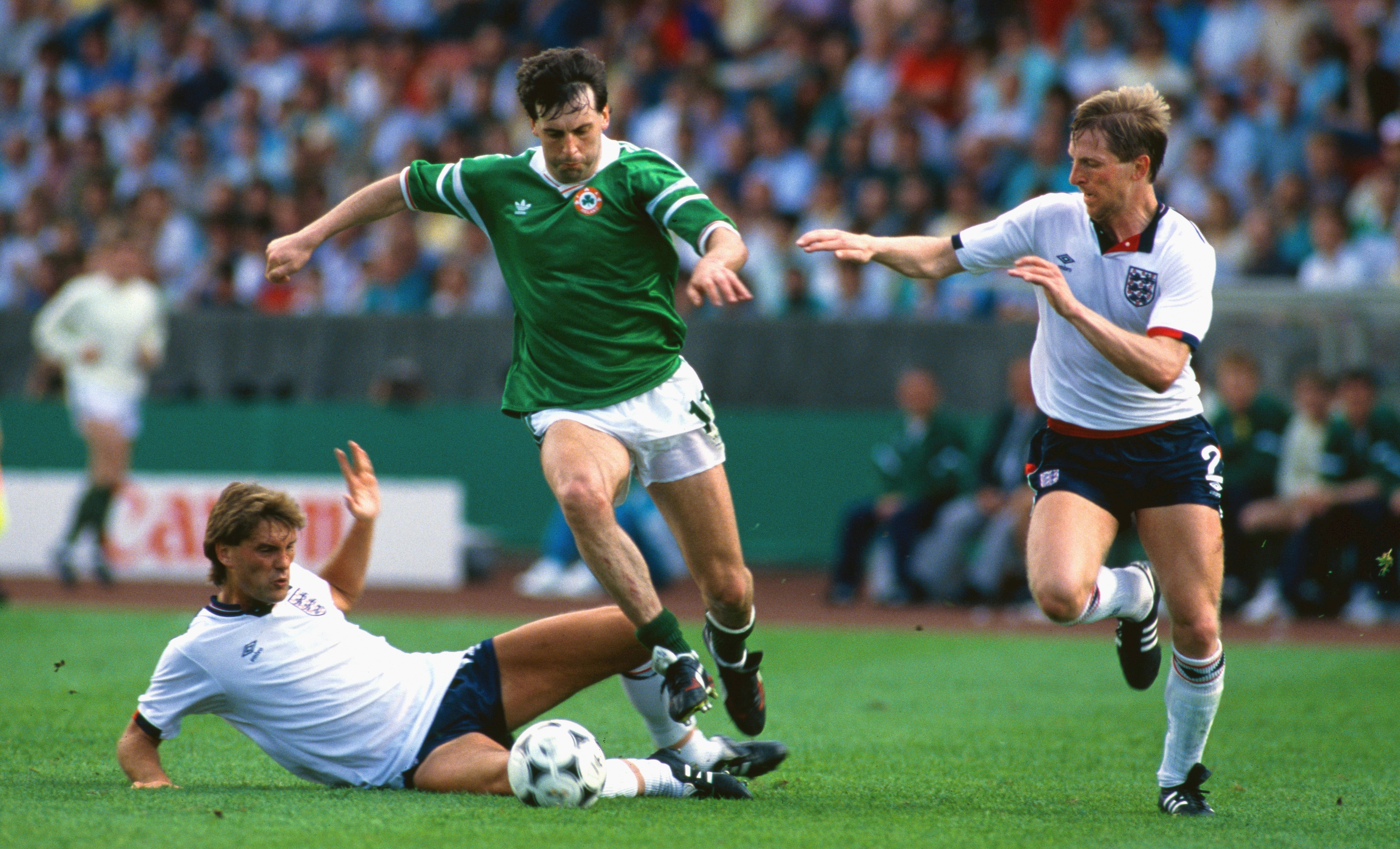 Tony Galvin overtakes Glenn Hoddle and Gary Stevens during Euro 88 in Stuttgart, West Germany