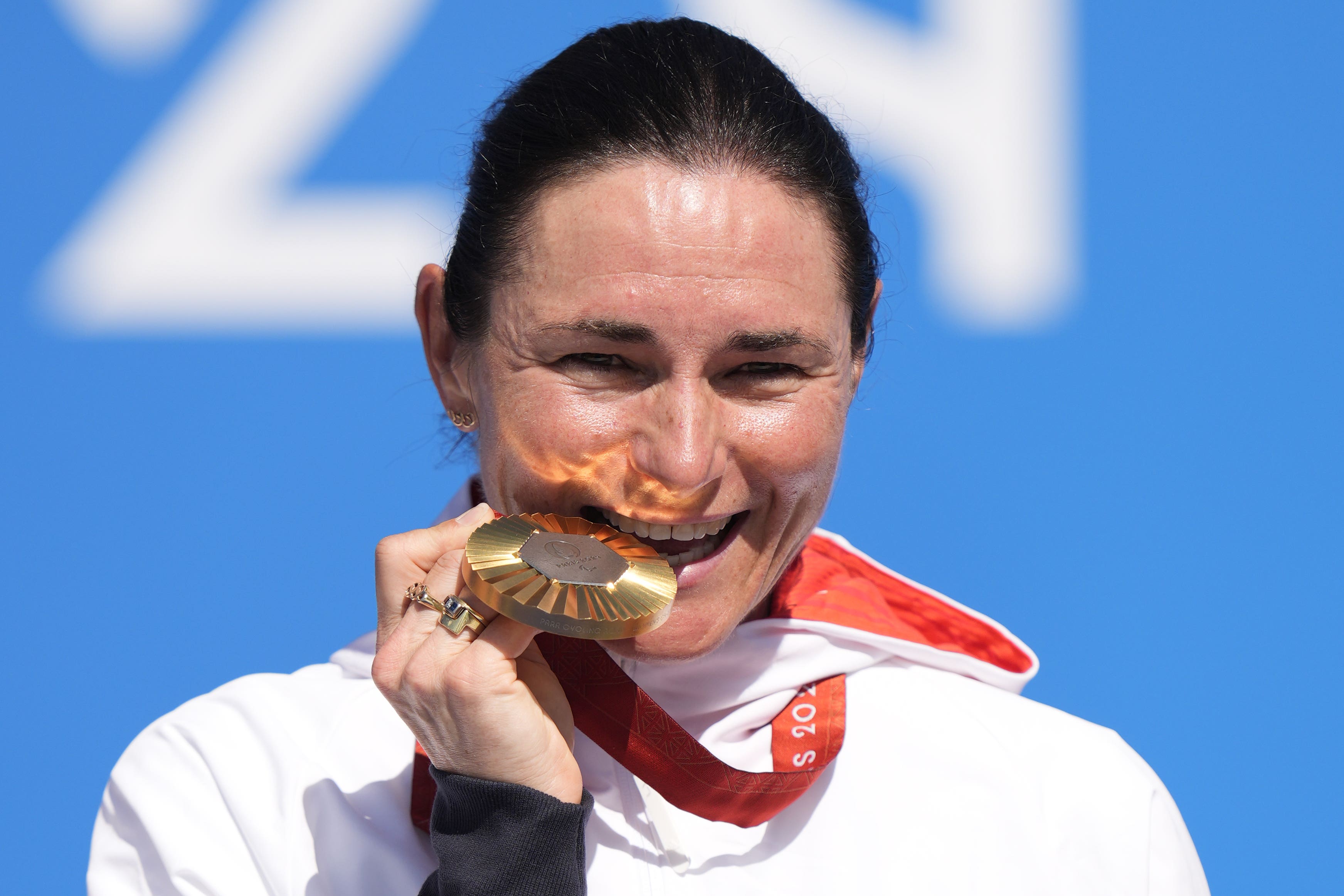 Dame Sarah Storey celebrates with her gold medal (Andrew Matthews/PA)