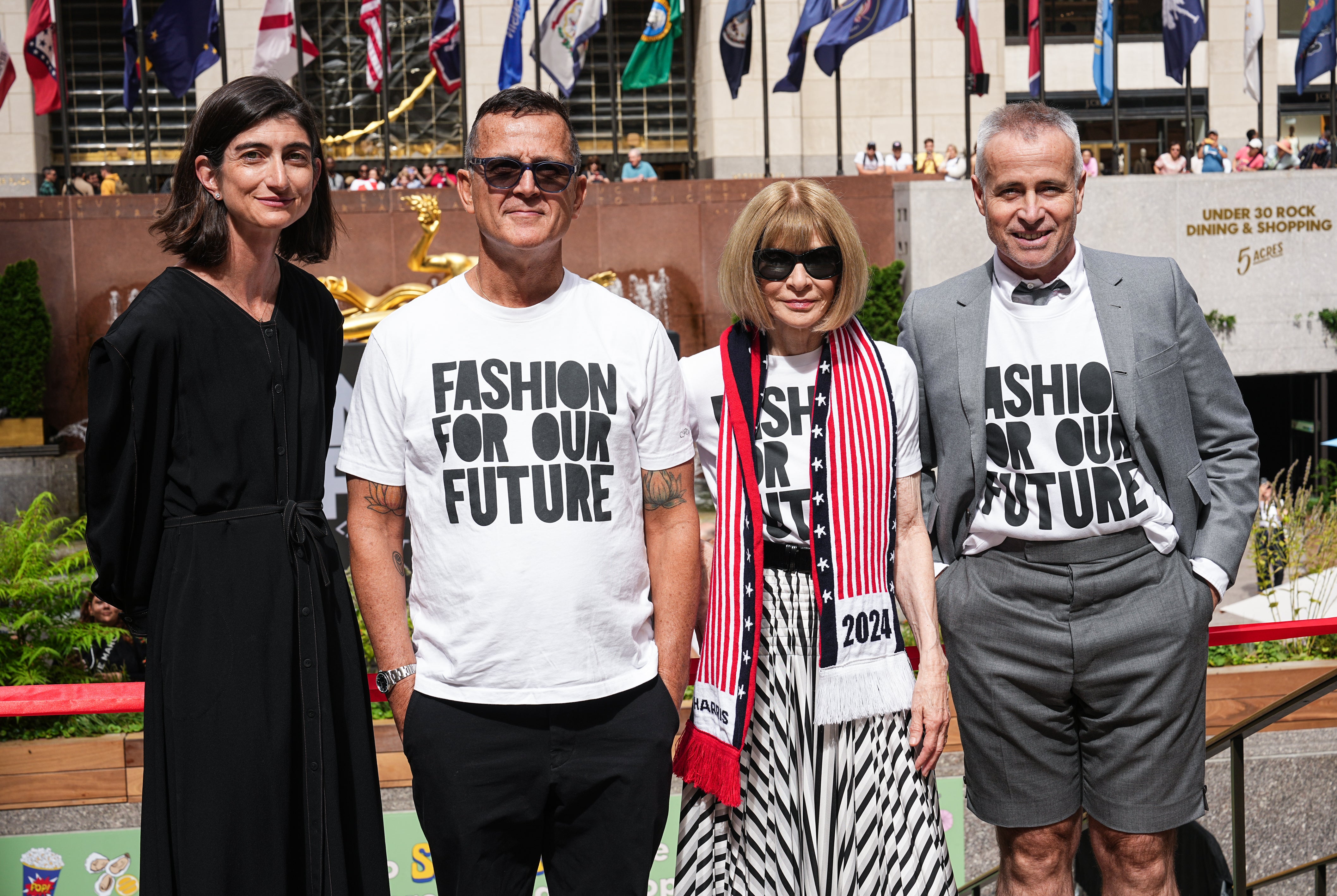 Anna Wintour poses with Thom Browne, EB Kelly, and Steven Kolb for Fashion For Our Future march in New York City