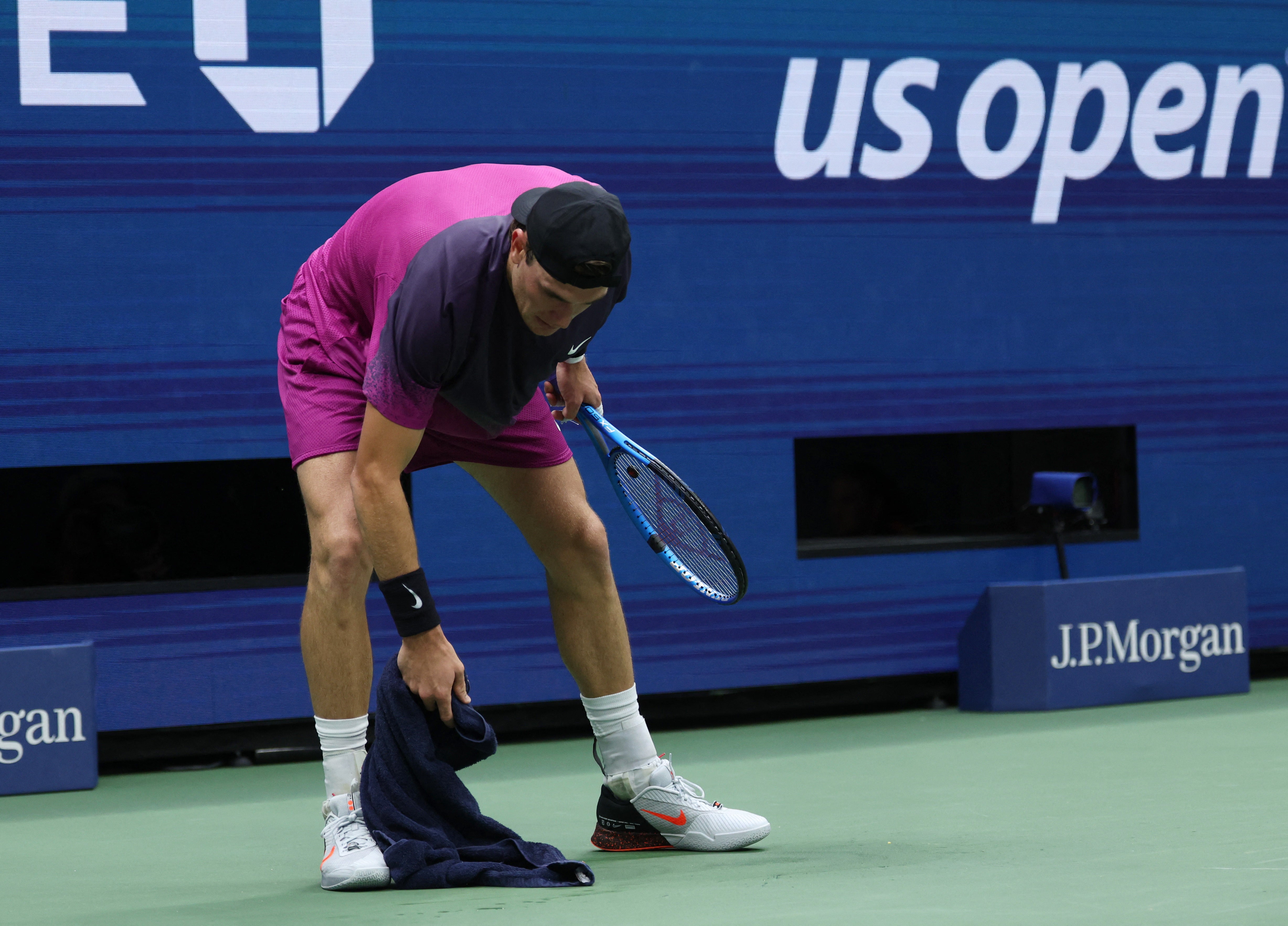 Draper wiped away his vomit on court