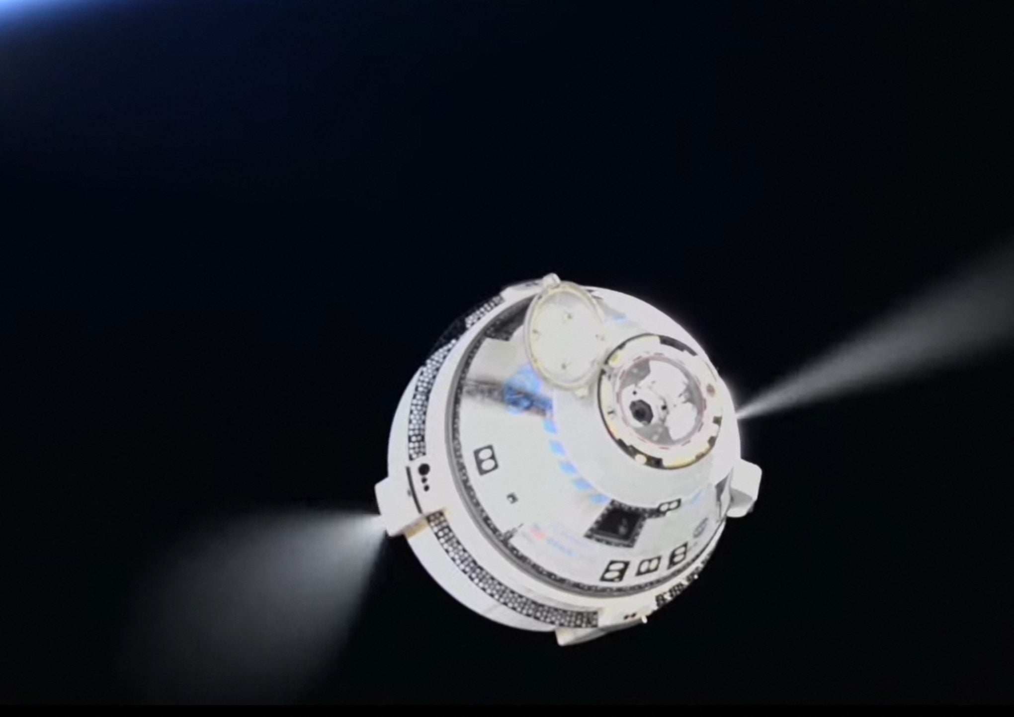 In this screen grab from a NASA livestream, the Boeing Starliner spacecraft can be seen departs from the International Space Station