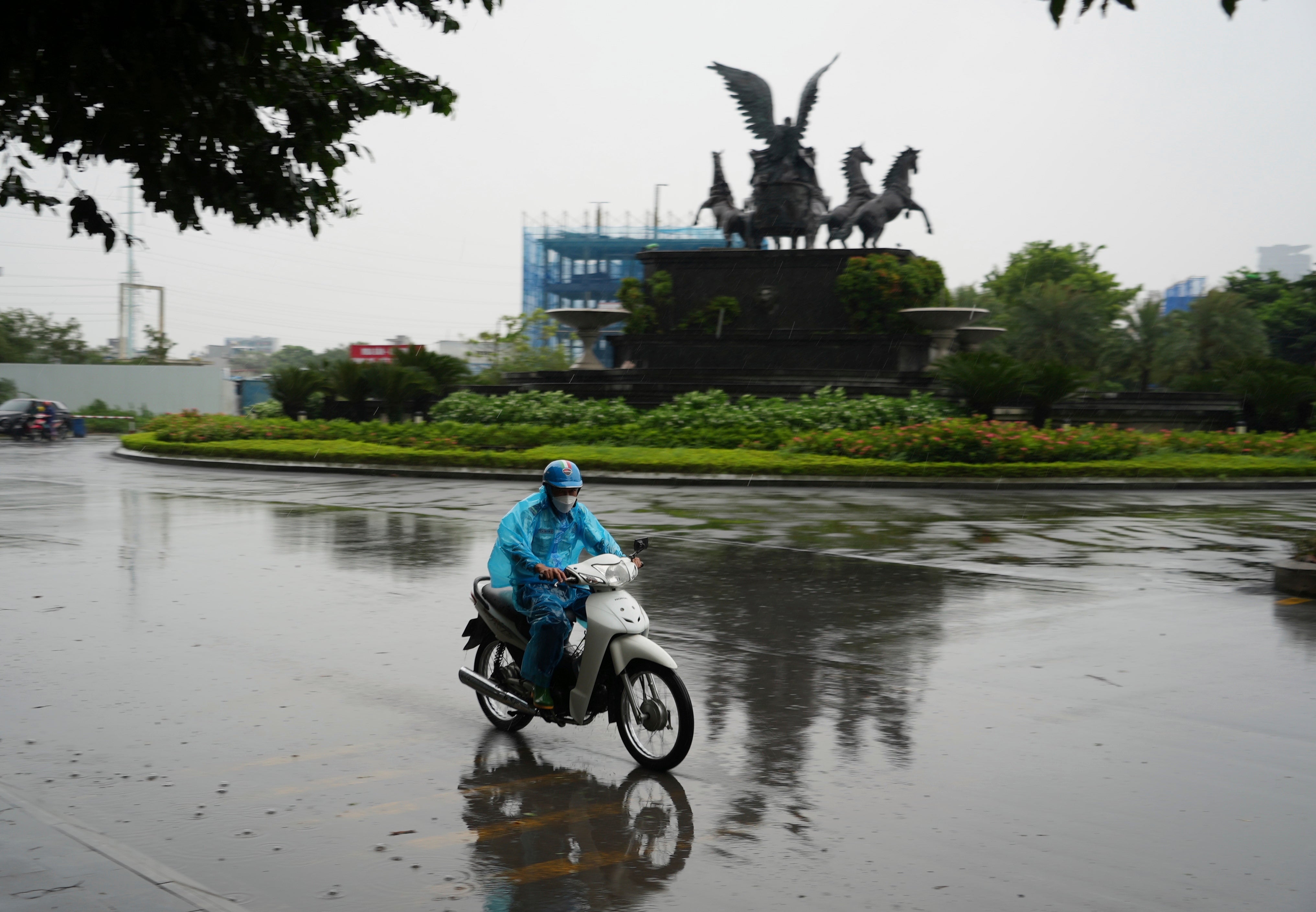 A man rides motorcycle in the rain caused by typhoon Yagi in Hanoi, Vietnam Saturday, 7 September 2024