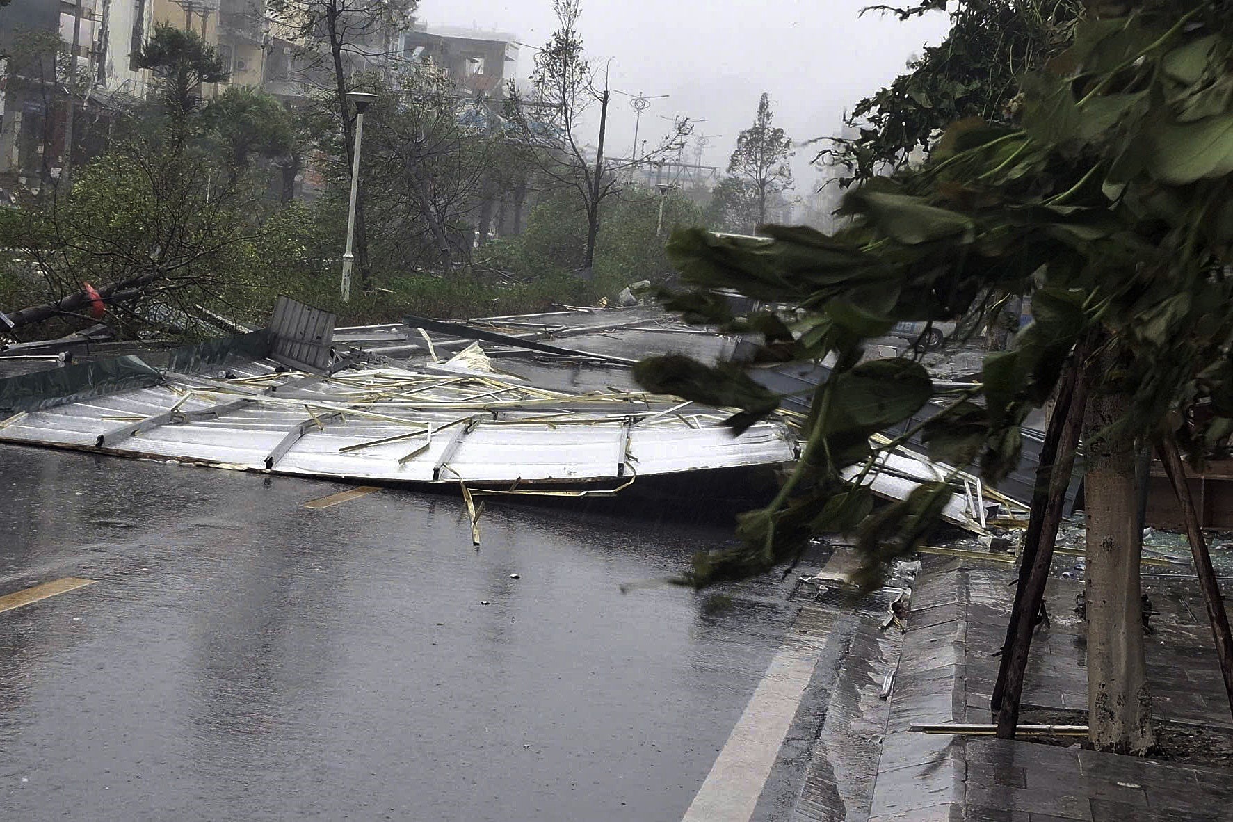 A handout photo made available by Vietnam News Agency shows debris on a street as typhoon Yagi makes landfall, in Quang Ninh province, Vietnam, 7 September 2024