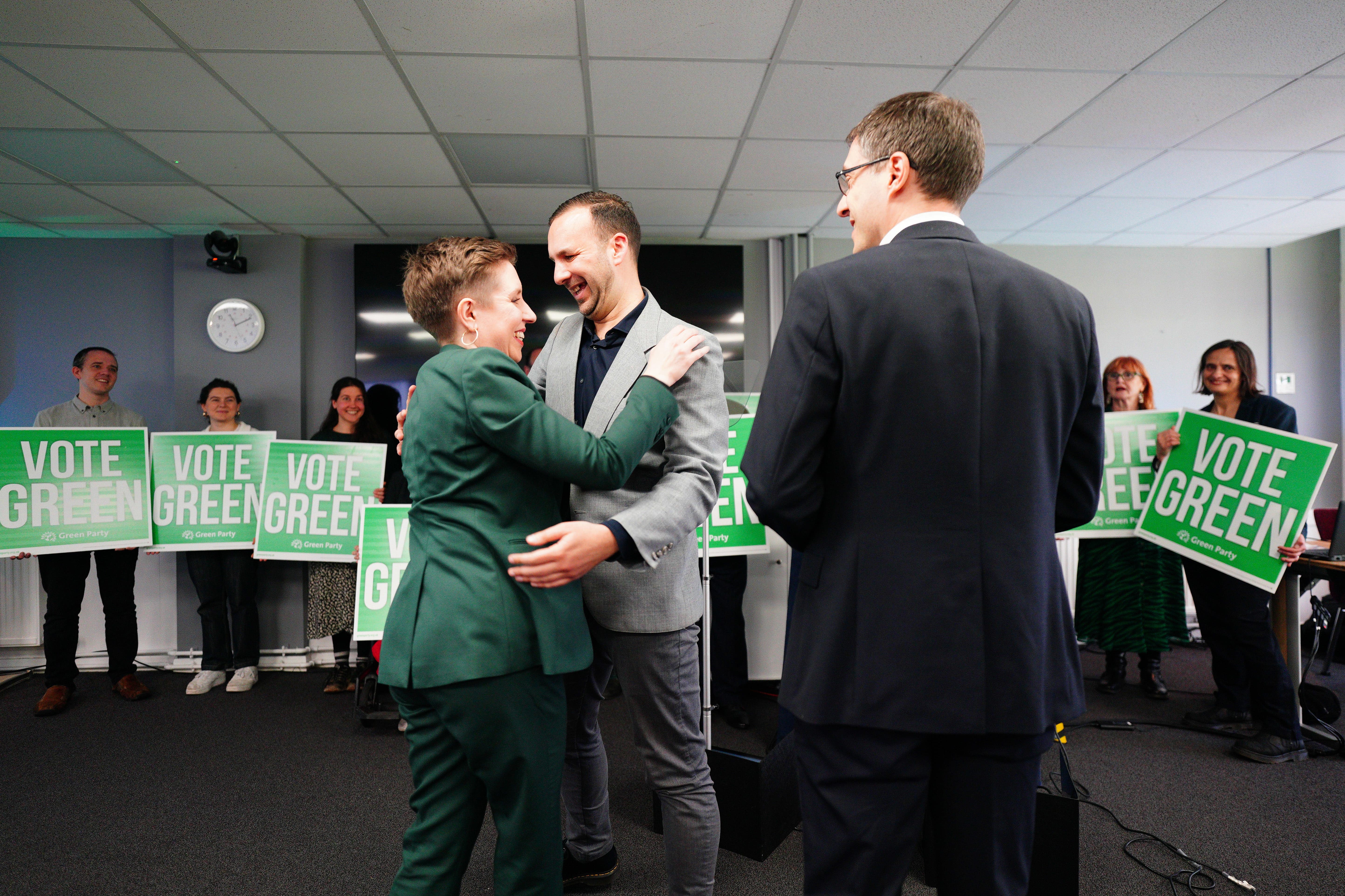 Green Party co-leaders Carla Denyer (left) and Adrian Ramsay (right) greet deputy leader Zack Polanski (Ben Birchall/PA)